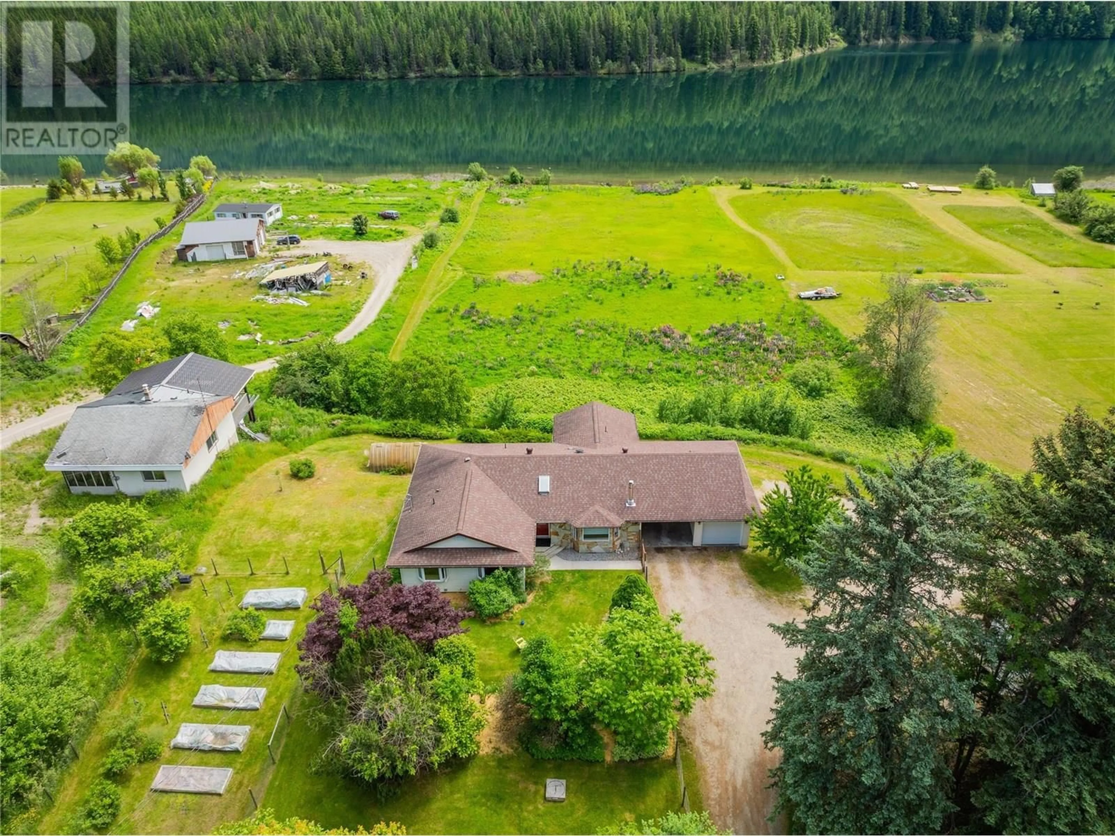 A pic from outside/outdoor area/front of a property/back of a property/a pic from drone, water/lake/river/ocean view for 1720 THRUMS ROAD, Castlegar British Columbia V1N4N4