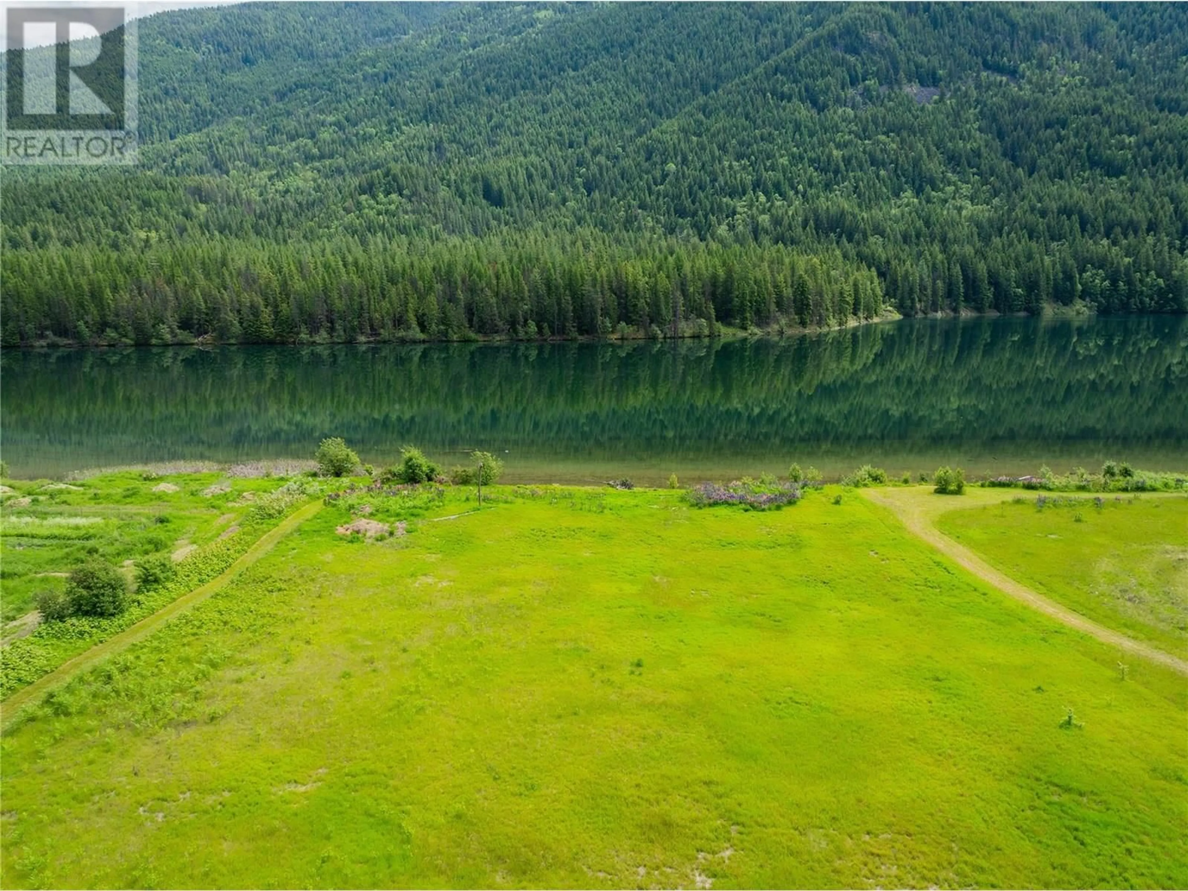 A pic from outside/outdoor area/front of a property/back of a property/a pic from drone, water/lake/river/ocean view for 1720 THRUMS ROAD, Castlegar British Columbia V1N4N4
