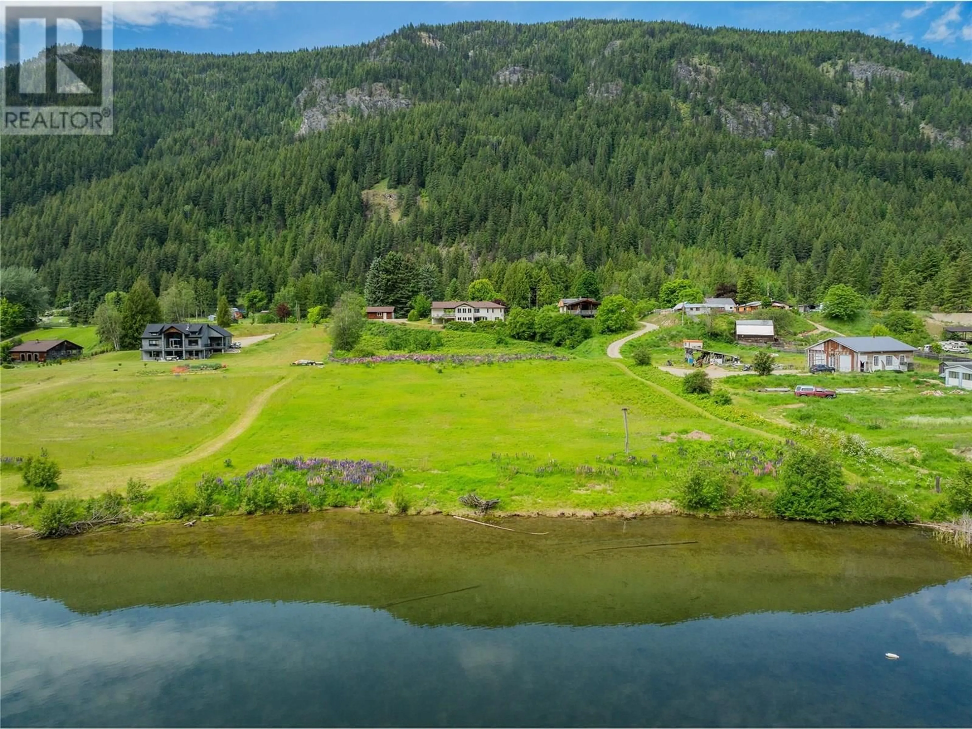 A pic from outside/outdoor area/front of a property/back of a property/a pic from drone, water/lake/river/ocean view for 1720 THRUMS ROAD, Castlegar British Columbia V1N4N4