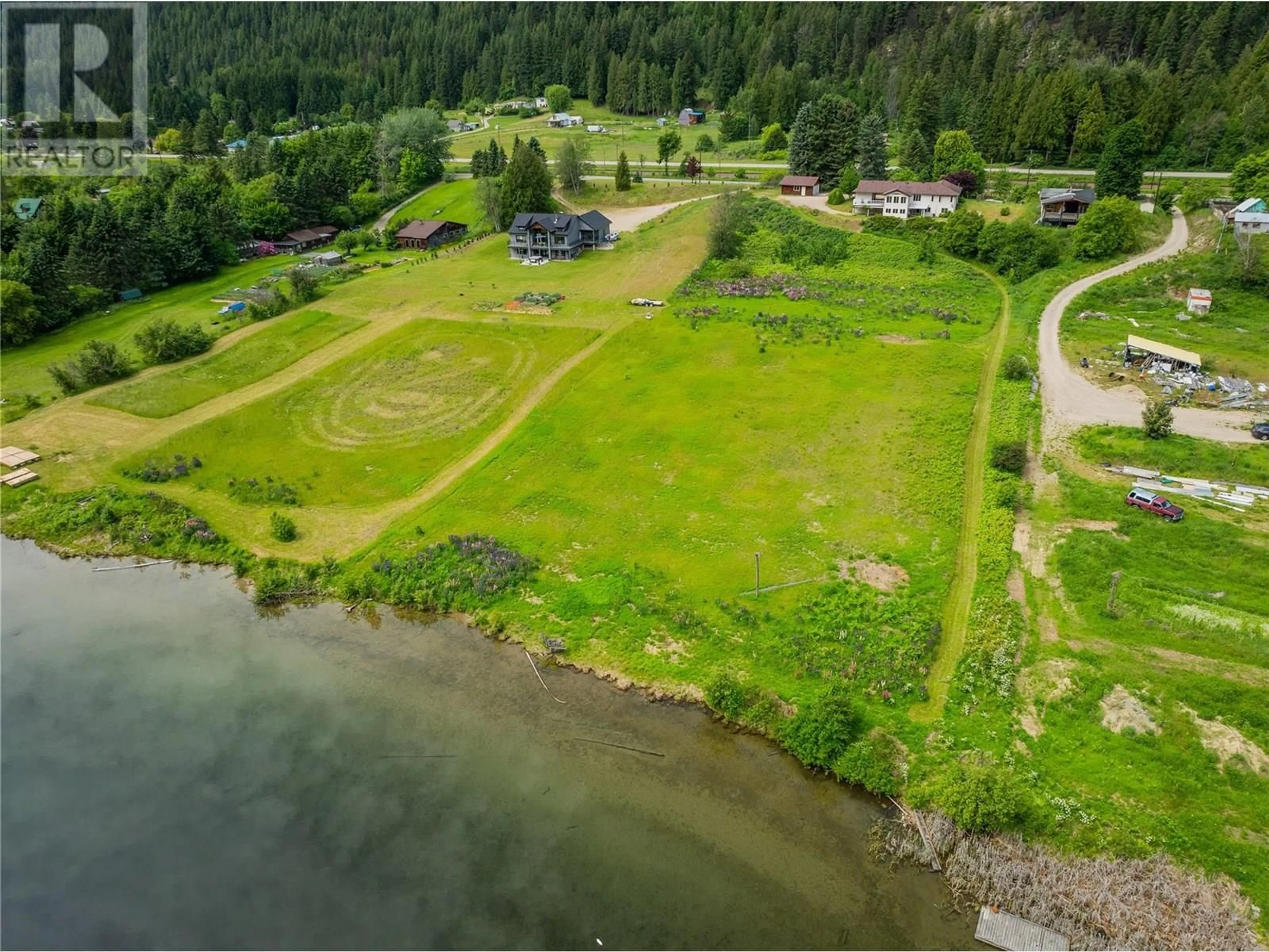 A pic from outside/outdoor area/front of a property/back of a property/a pic from drone, water/lake/river/ocean view for 1720 THRUMS ROAD, Castlegar British Columbia V1N4N4