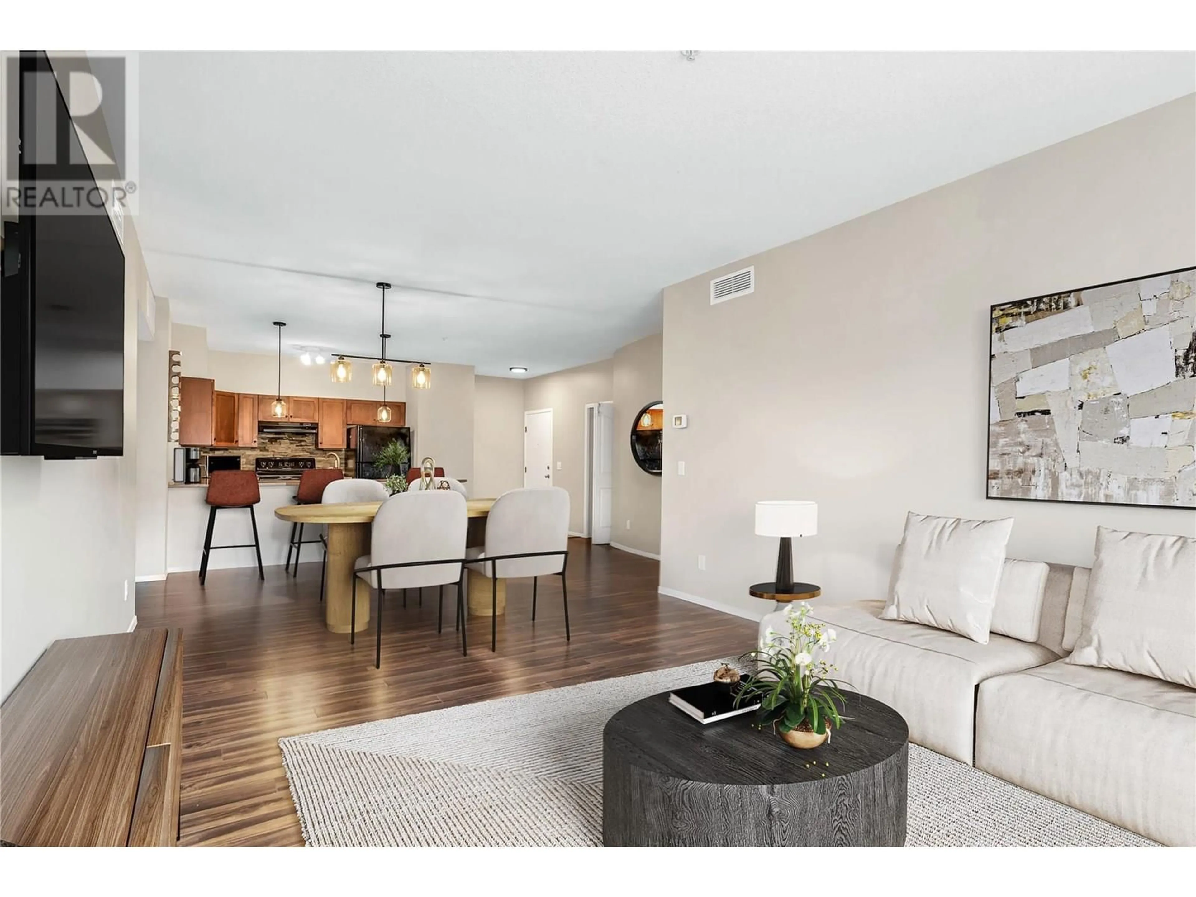 Living room with furniture, wood/laminate floor for 1102 - 3168 VIA CENTRALE OTHER, Kelowna British Columbia V1V2R6