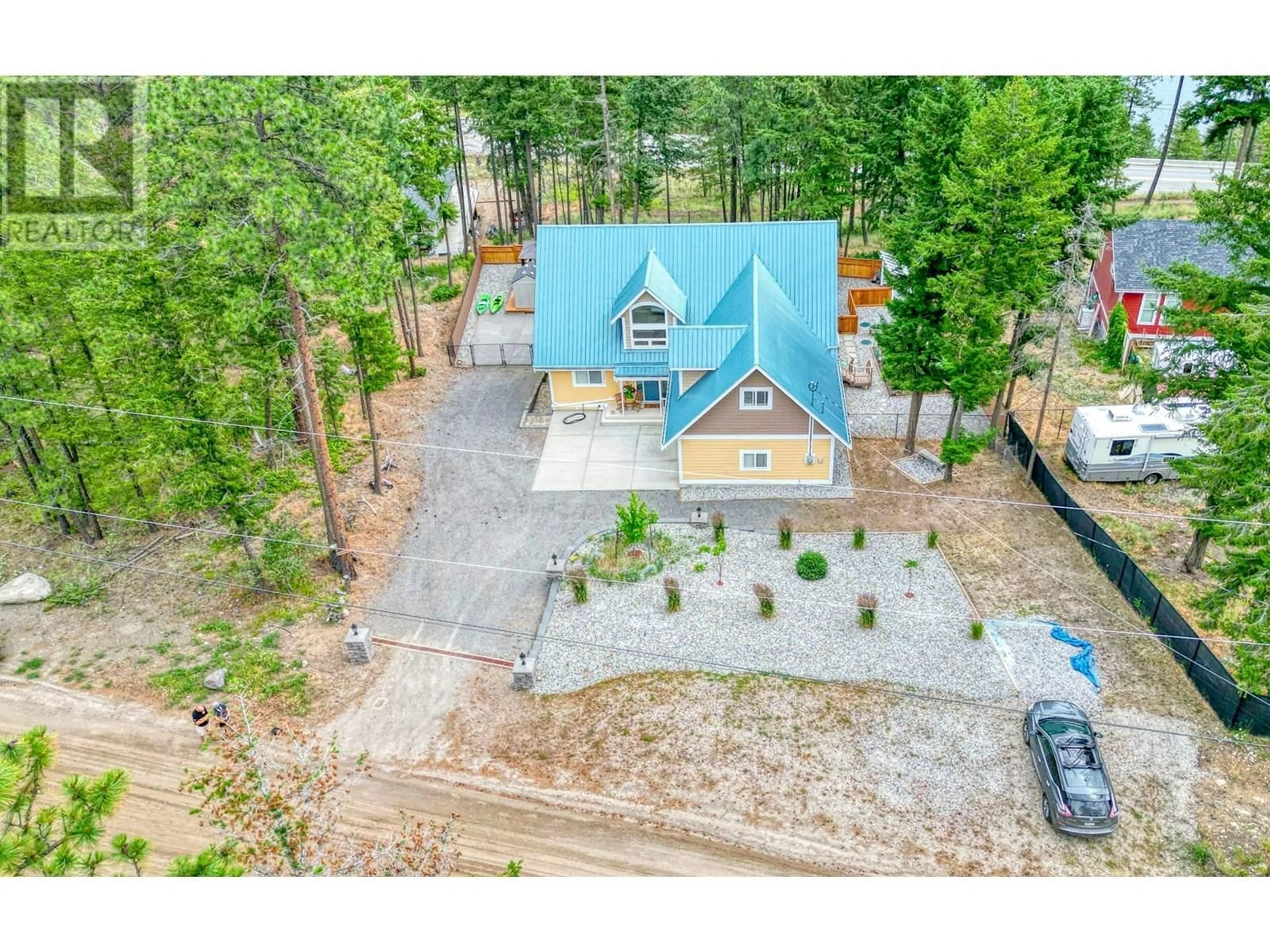 A pic from outside/outdoor area/front of a property/back of a property/a pic from drone, mountain view for 7271 DUNWATERS ROAD, Kelowna British Columbia V1Z3W4