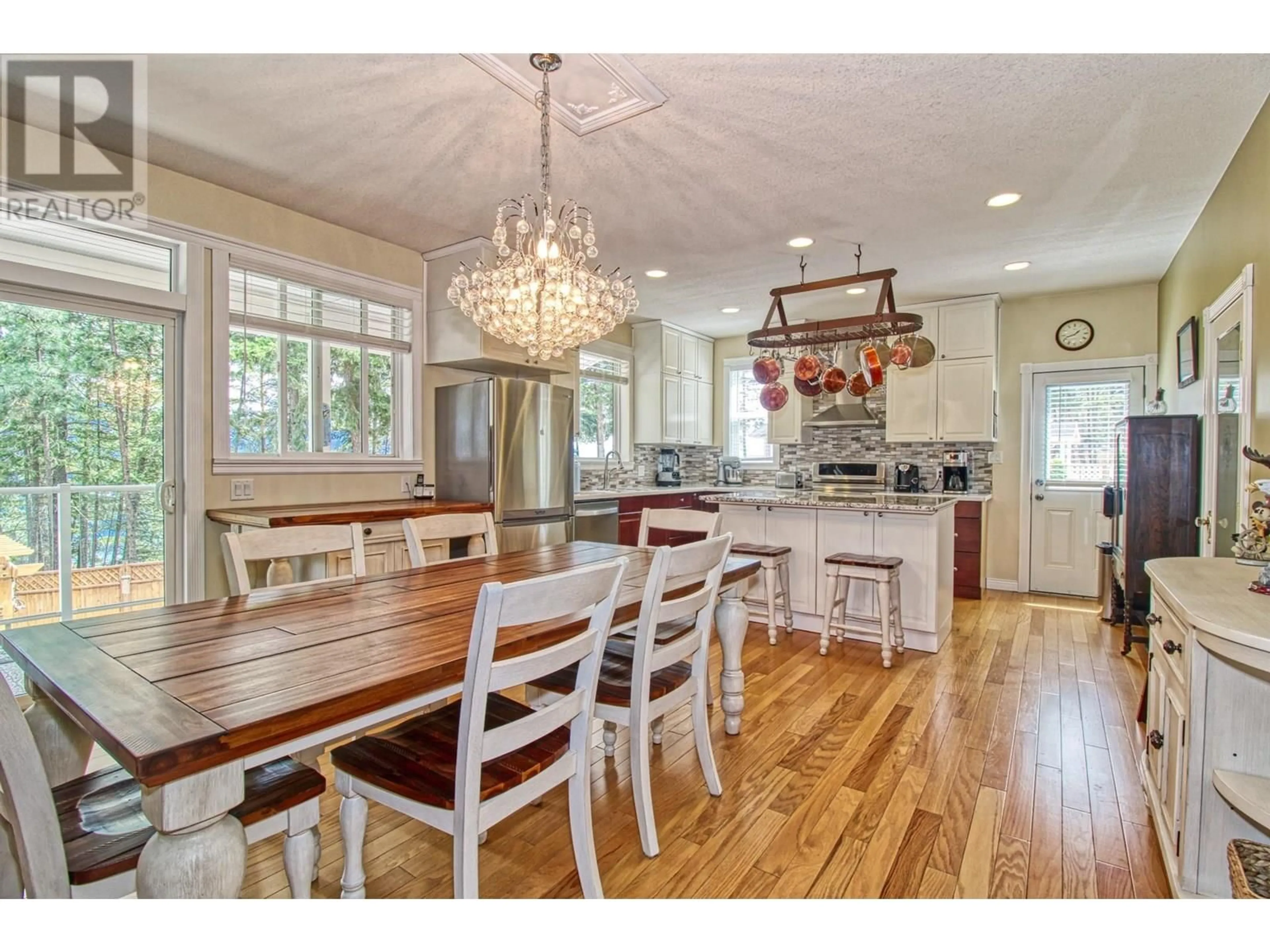 Open concept kitchen, wood/laminate floor for 7271 DUNWATERS ROAD, Kelowna British Columbia V1Z3W4