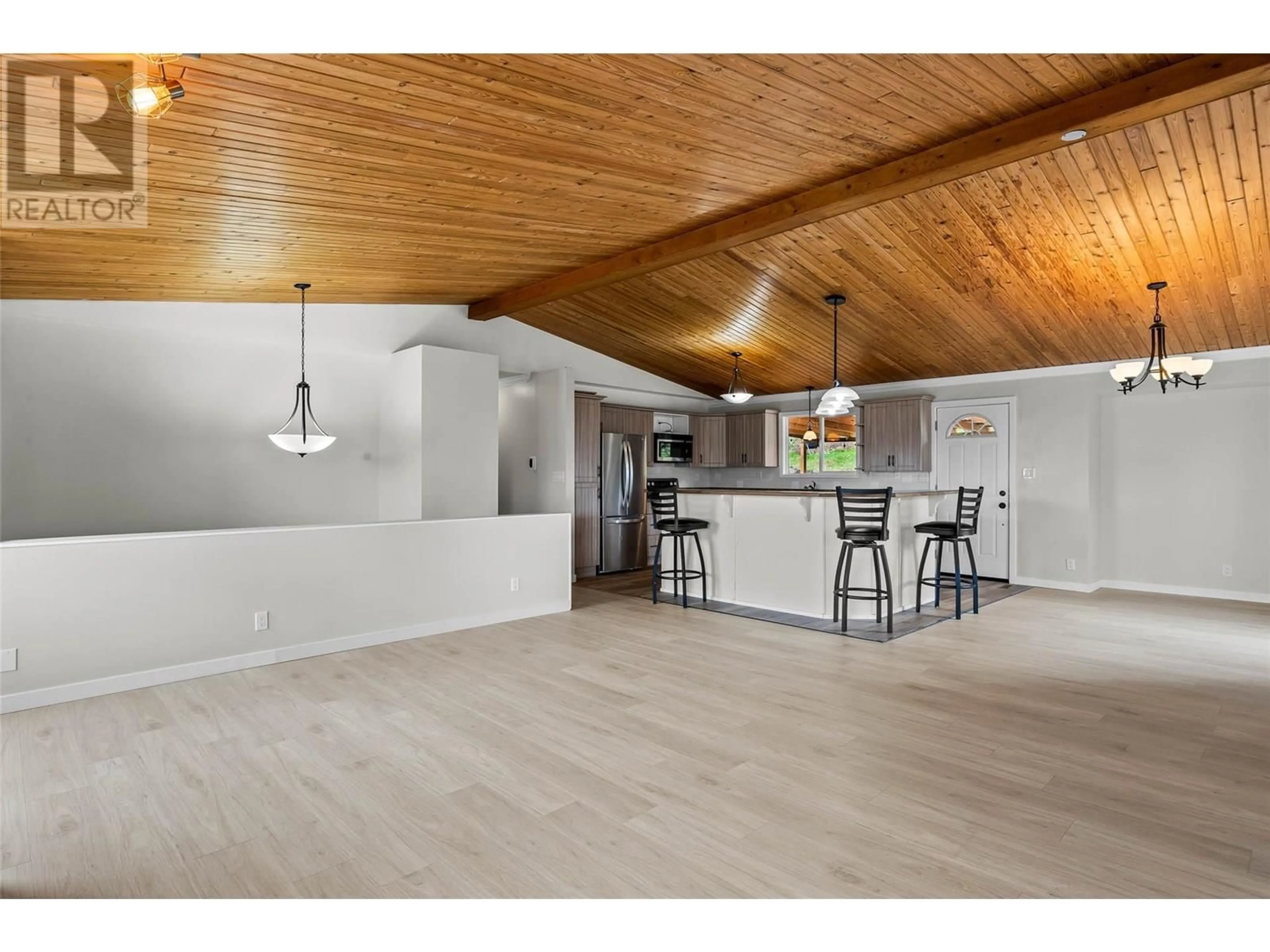 Open concept kitchen, wood/laminate floor for 403 GLENEAGLES DRIVE, Kamloops British Columbia V2E1Y4