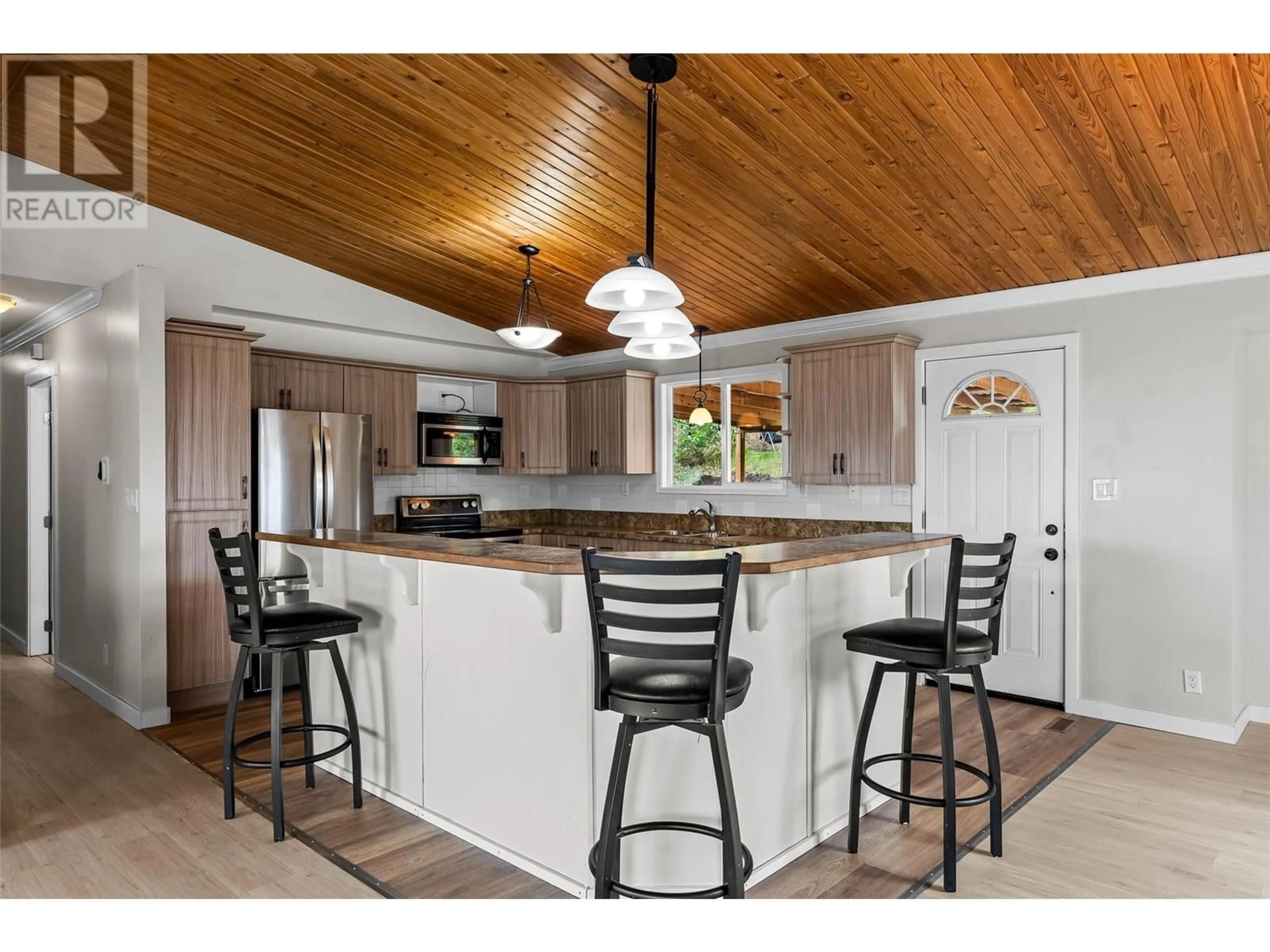 Open concept kitchen, wood/laminate floor for 403 GLENEAGLES DRIVE, Kamloops British Columbia V2E1Y4