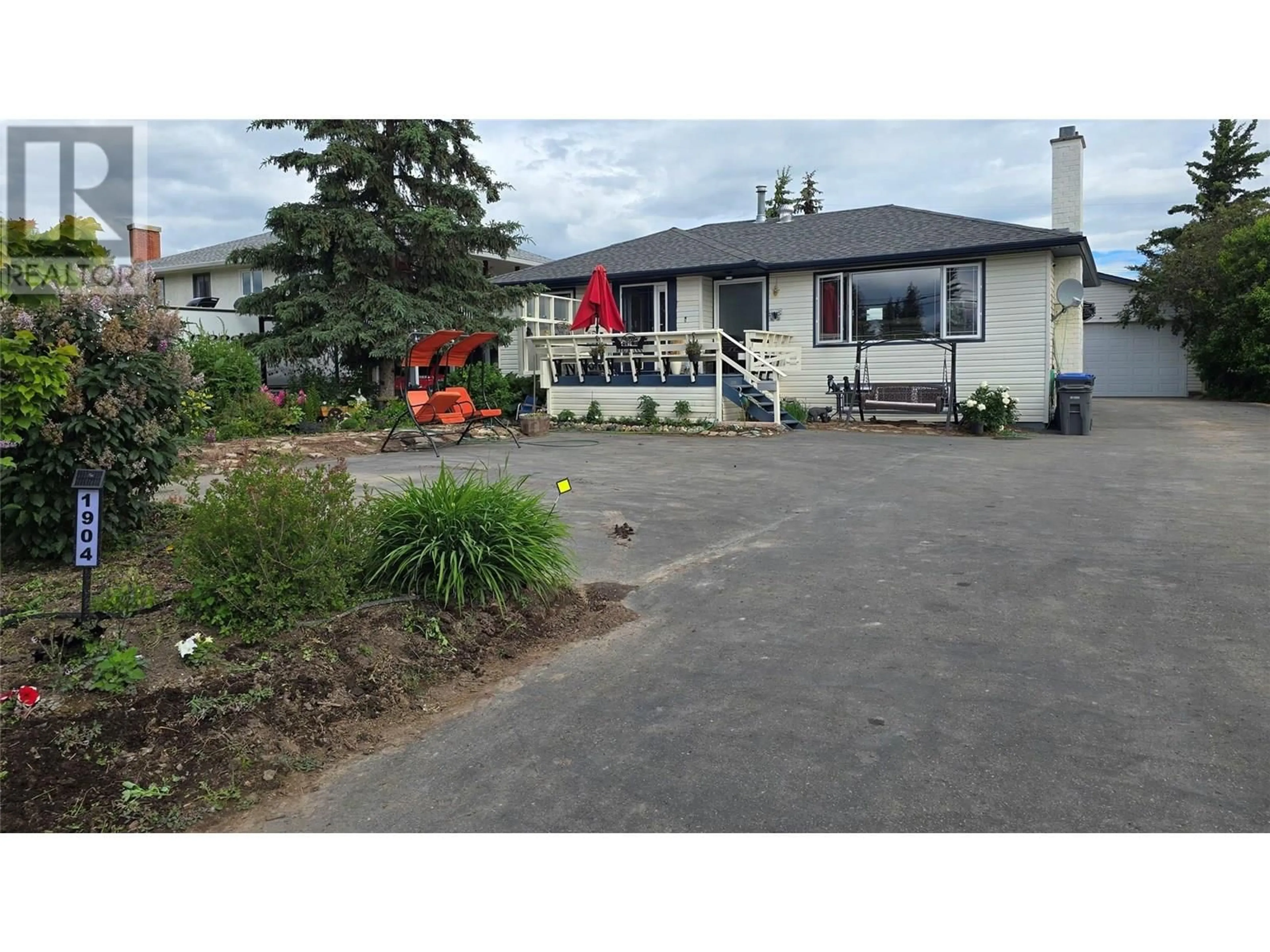 A pic from outside/outdoor area/front of a property/back of a property/a pic from drone, street for 1904 108 AVENUE, Dawson Creek British Columbia V1G2T8
