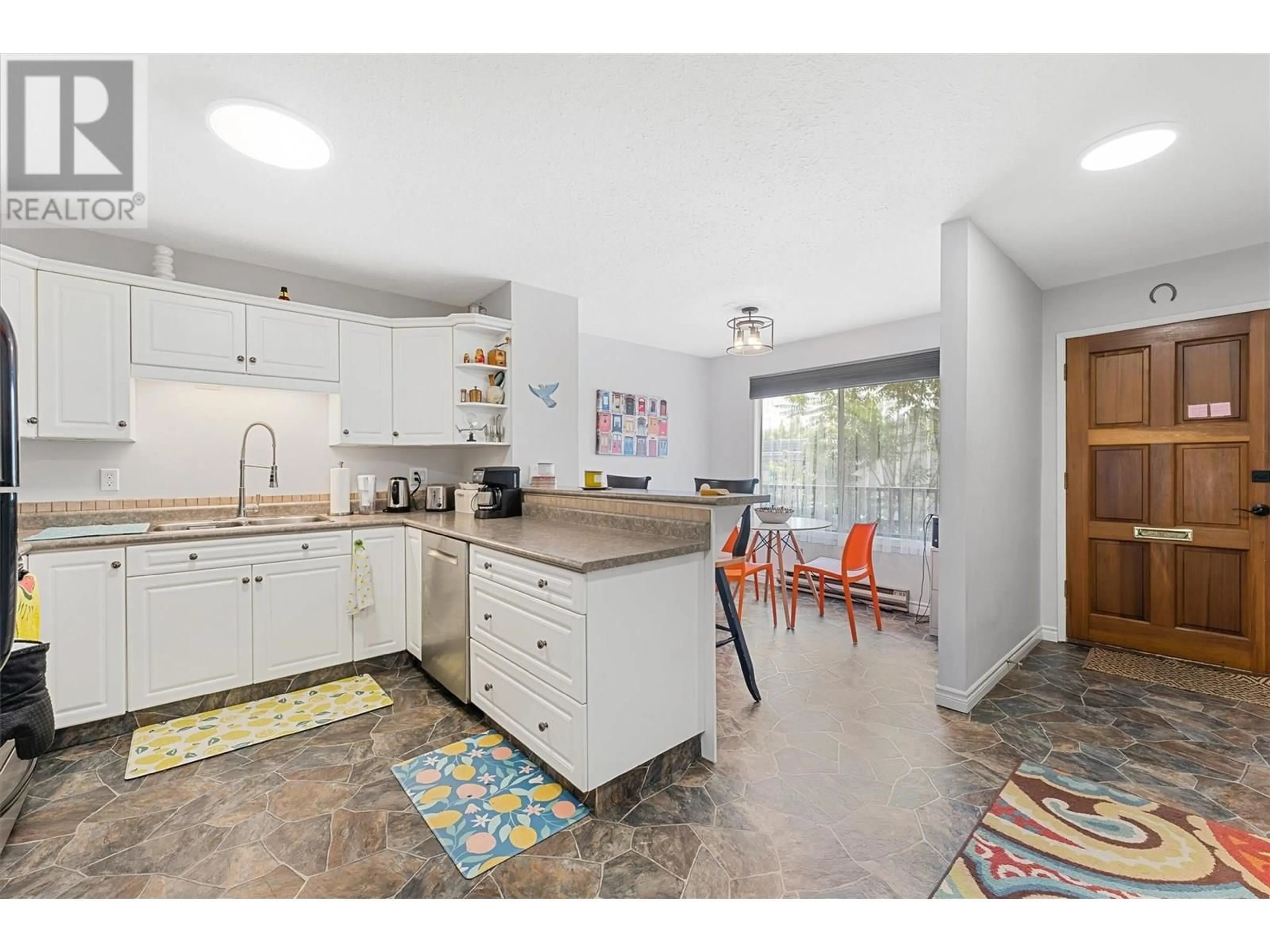 Open concept kitchen, ceramic/tile floor for 201 - 290 MILLS ROAD, Kelowna British Columbia V1X4G8