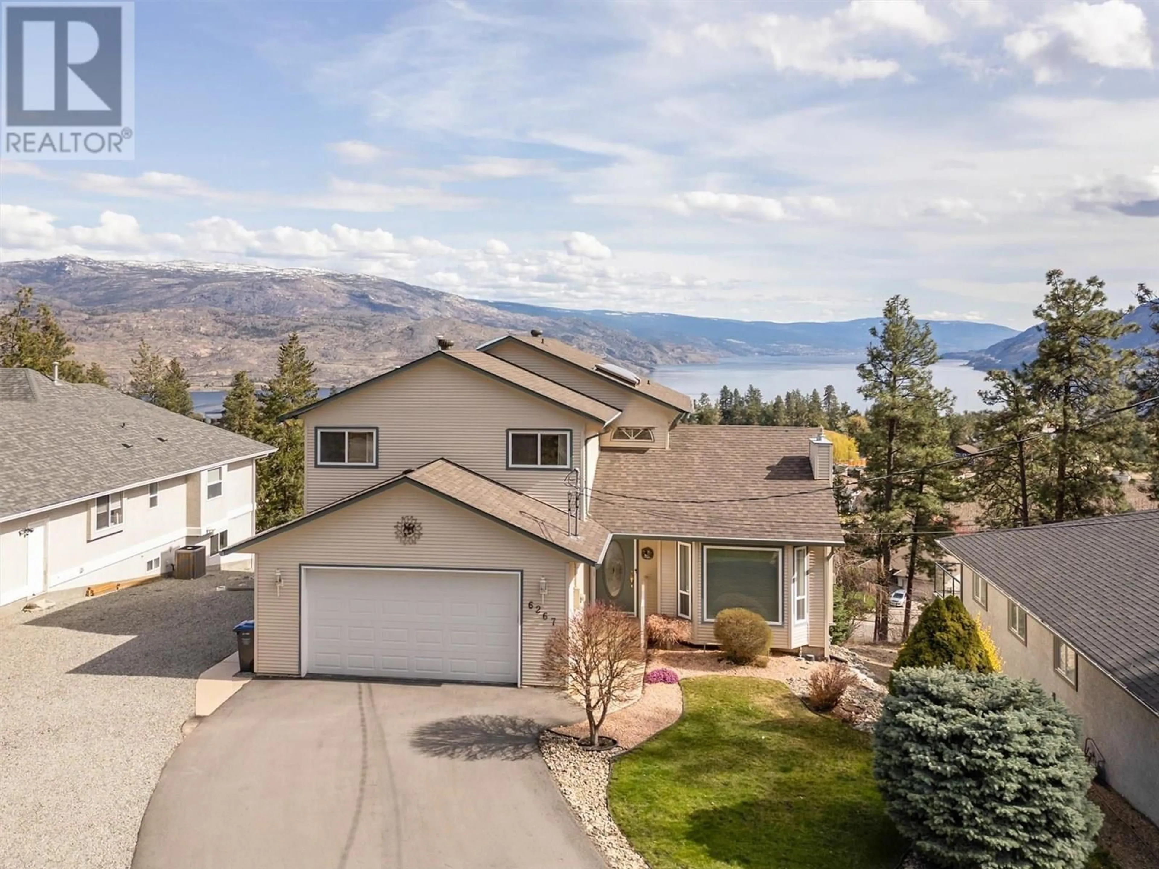 A pic from outside/outdoor area/front of a property/back of a property/a pic from drone, mountain view for 6267 THOMPSON DRIVE, Peachland British Columbia V0H1X8