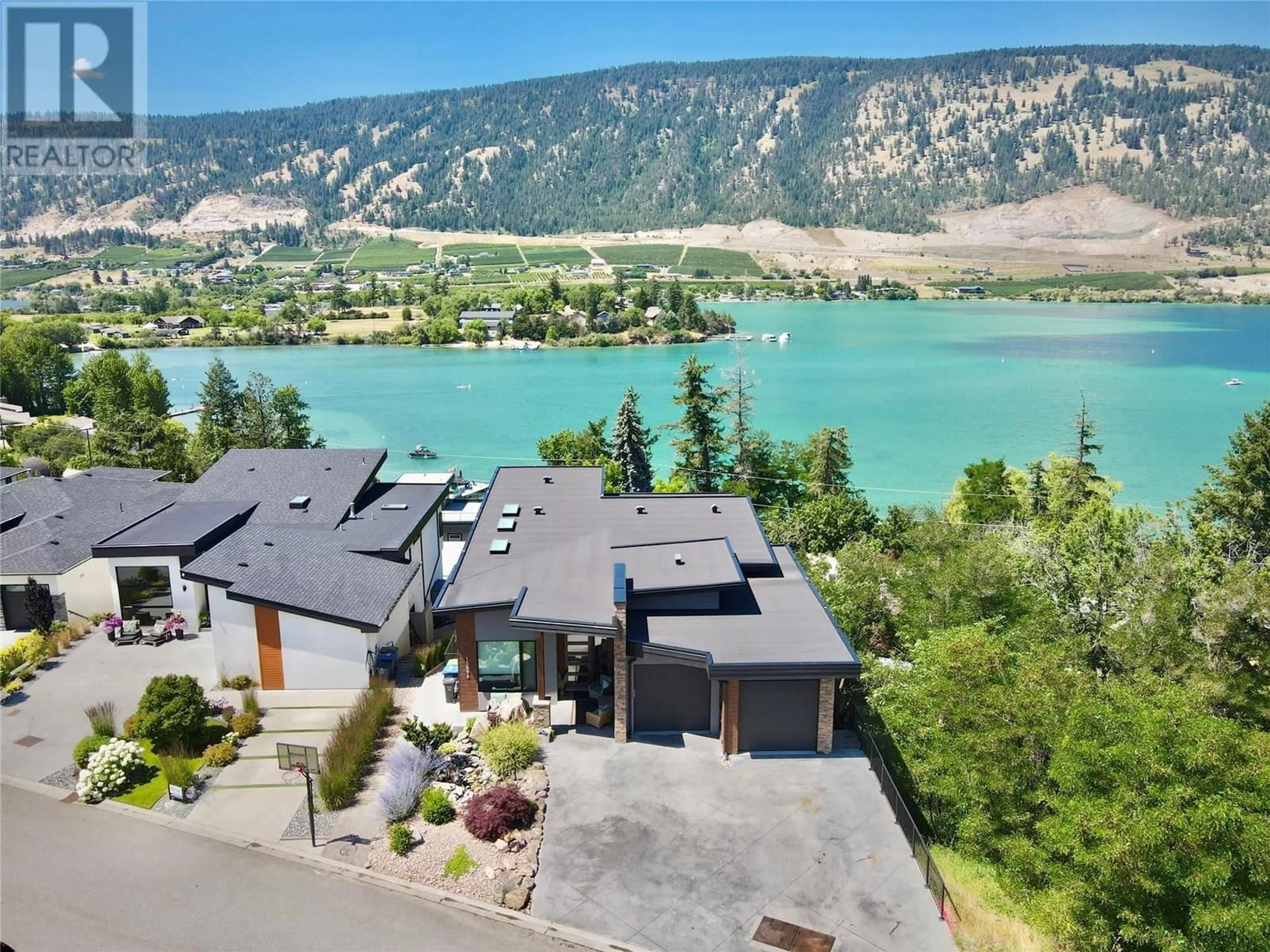 A pic from outside/outdoor area/front of a property/back of a property/a pic from drone, water/lake/river/ocean view for 15896 CLARIDGE DRIVE, Lake Country British Columbia V4V2T6