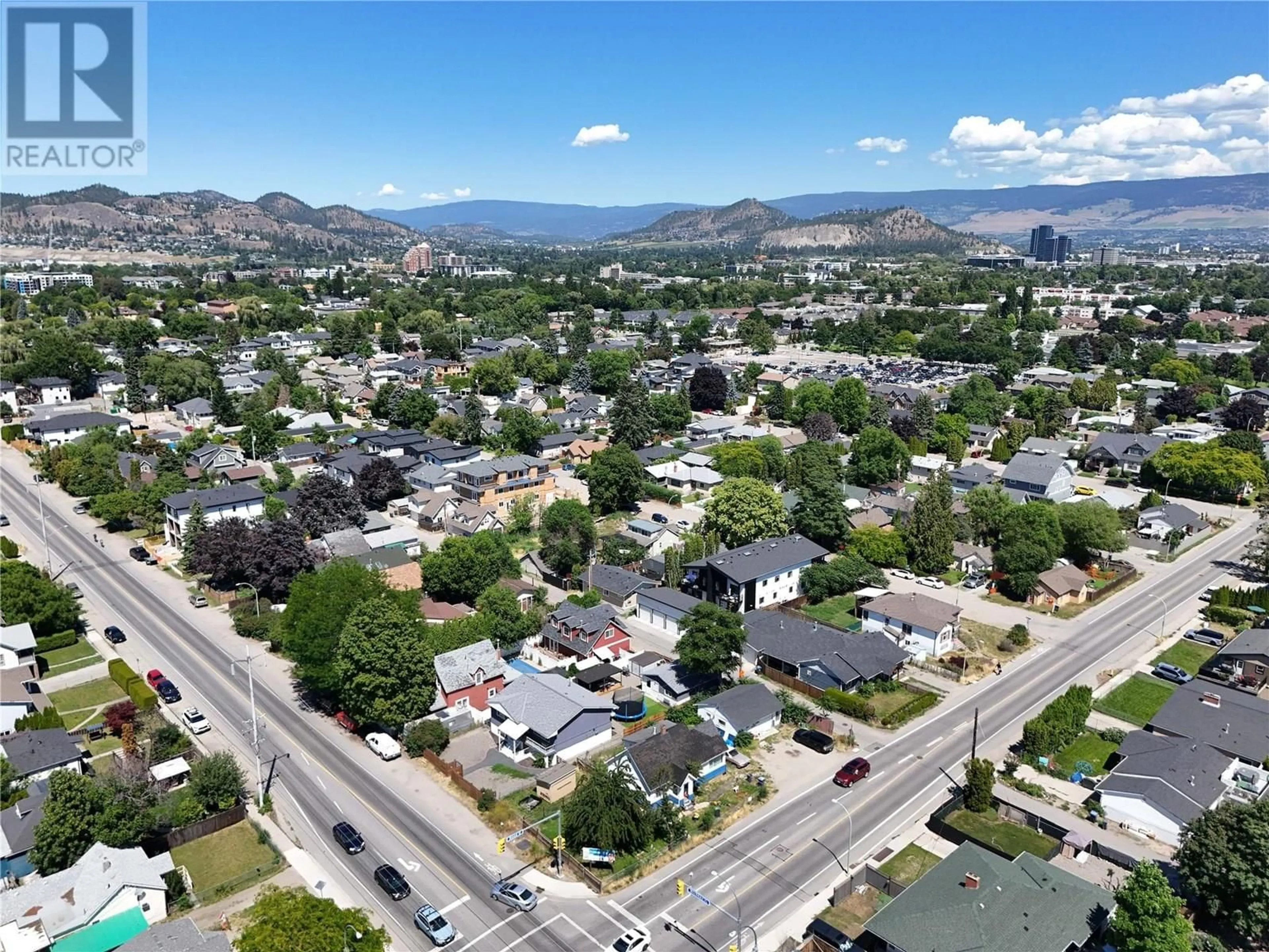 A pic from outside/outdoor area/front of a property/back of a property/a pic from drone, mountain view for 706 ROSE AVENUE, Kelowna British Columbia V1Y5K2