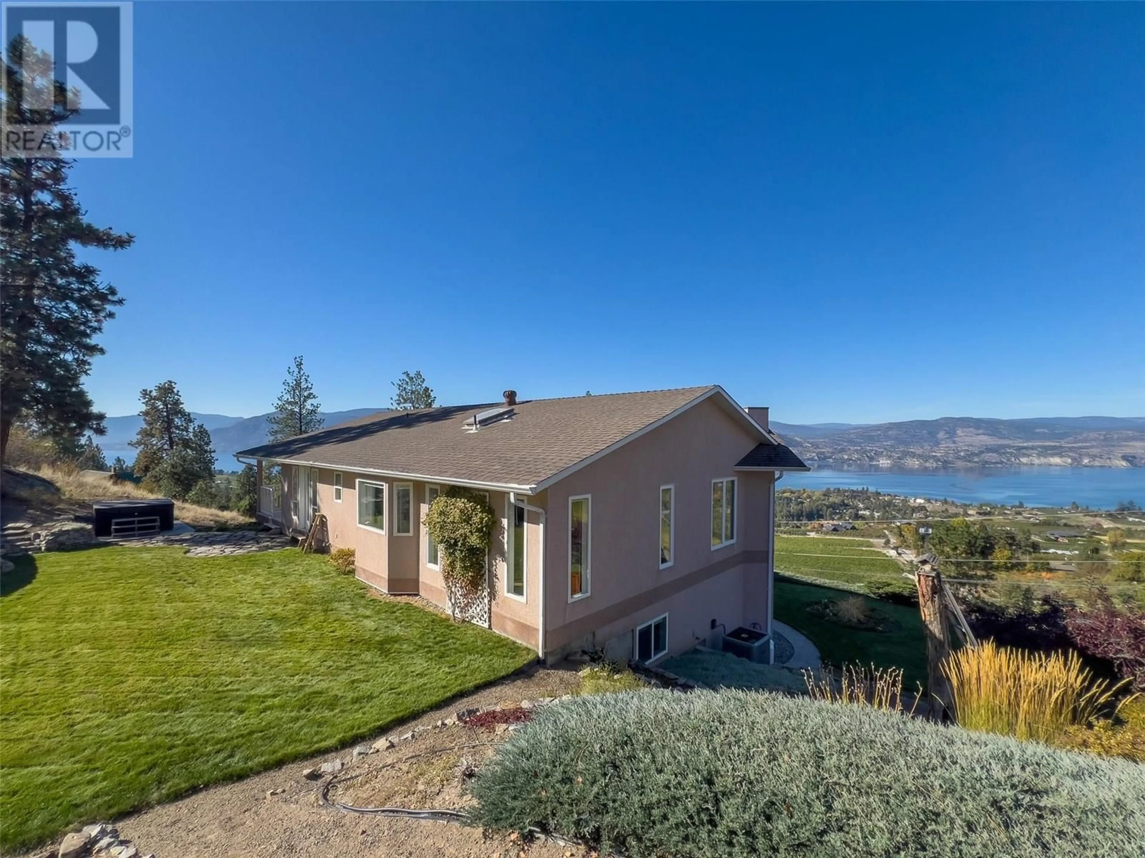 A pic from outside/outdoor area/front of a property/back of a property/a pic from drone, water/lake/river/ocean view for 1380 SMETHURST ROAD, Naramata British Columbia V0H1N1