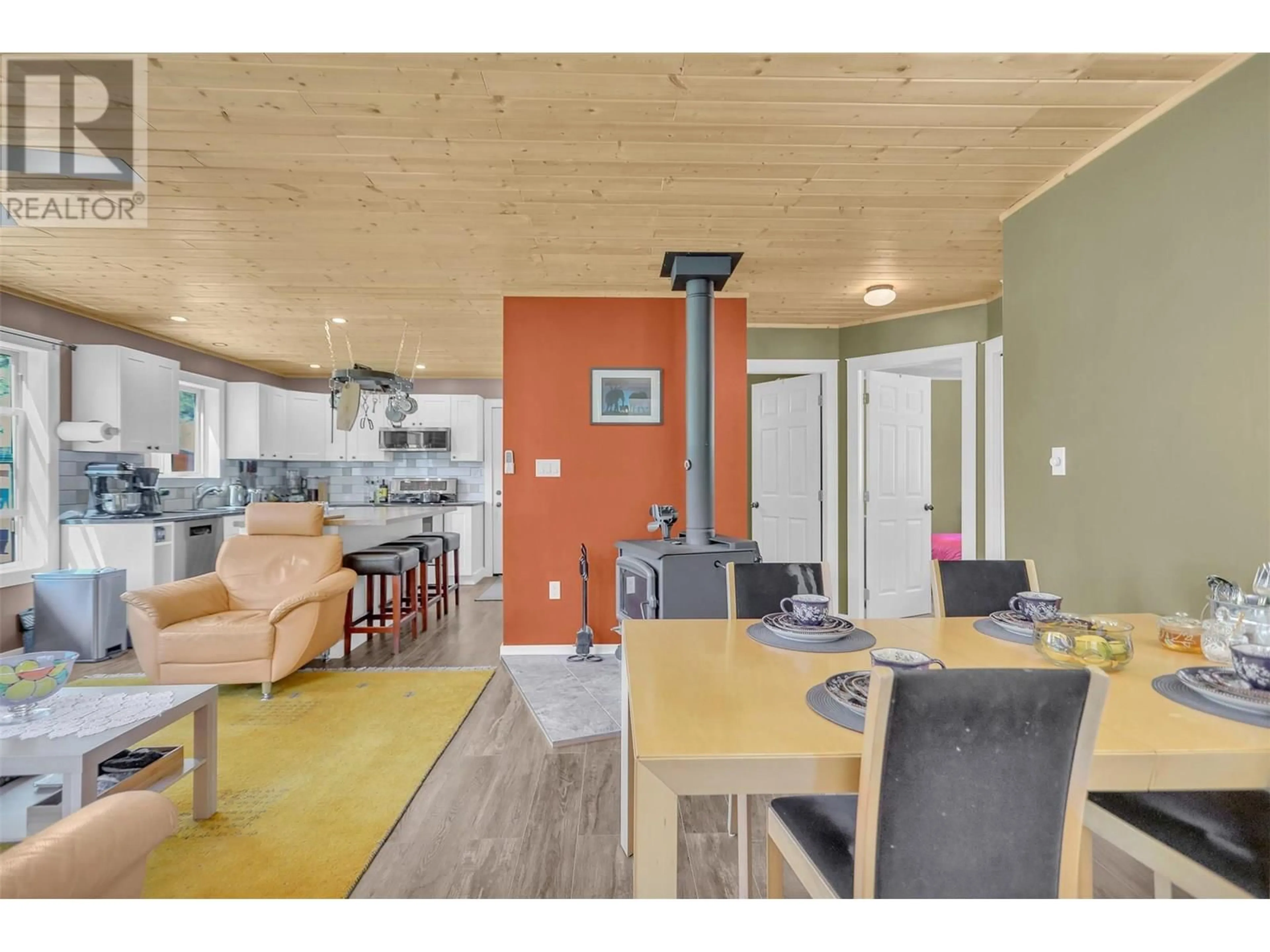 Open concept kitchen, wood/laminate floor for 3445 BLYTHE-RHONE ROAD, Westbridge British Columbia V0H1Y0