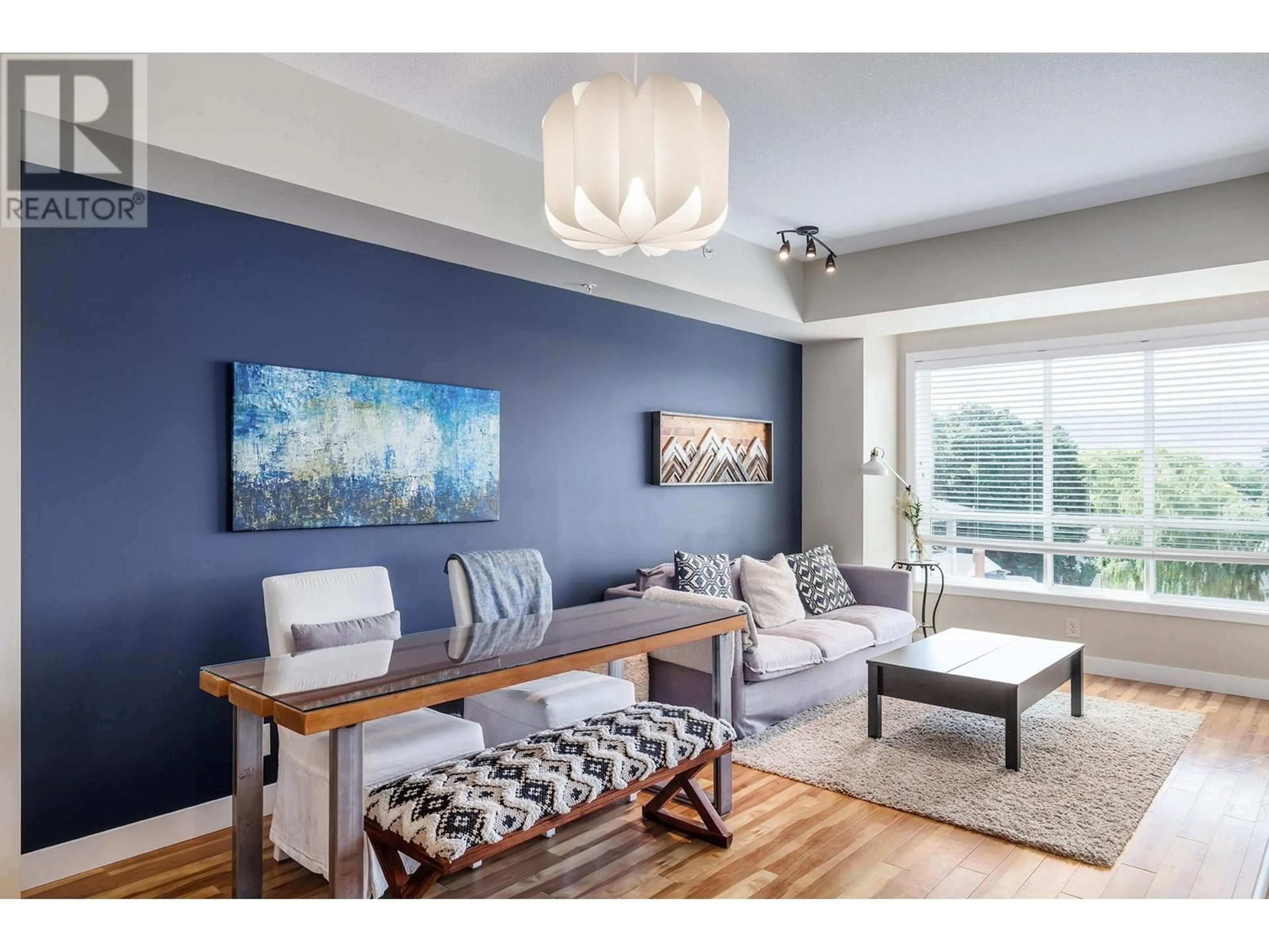 Living room with furniture, wood/laminate floor for 411 - 850 SAUCIER AVENUE, Kelowna British Columbia V1Y6A3