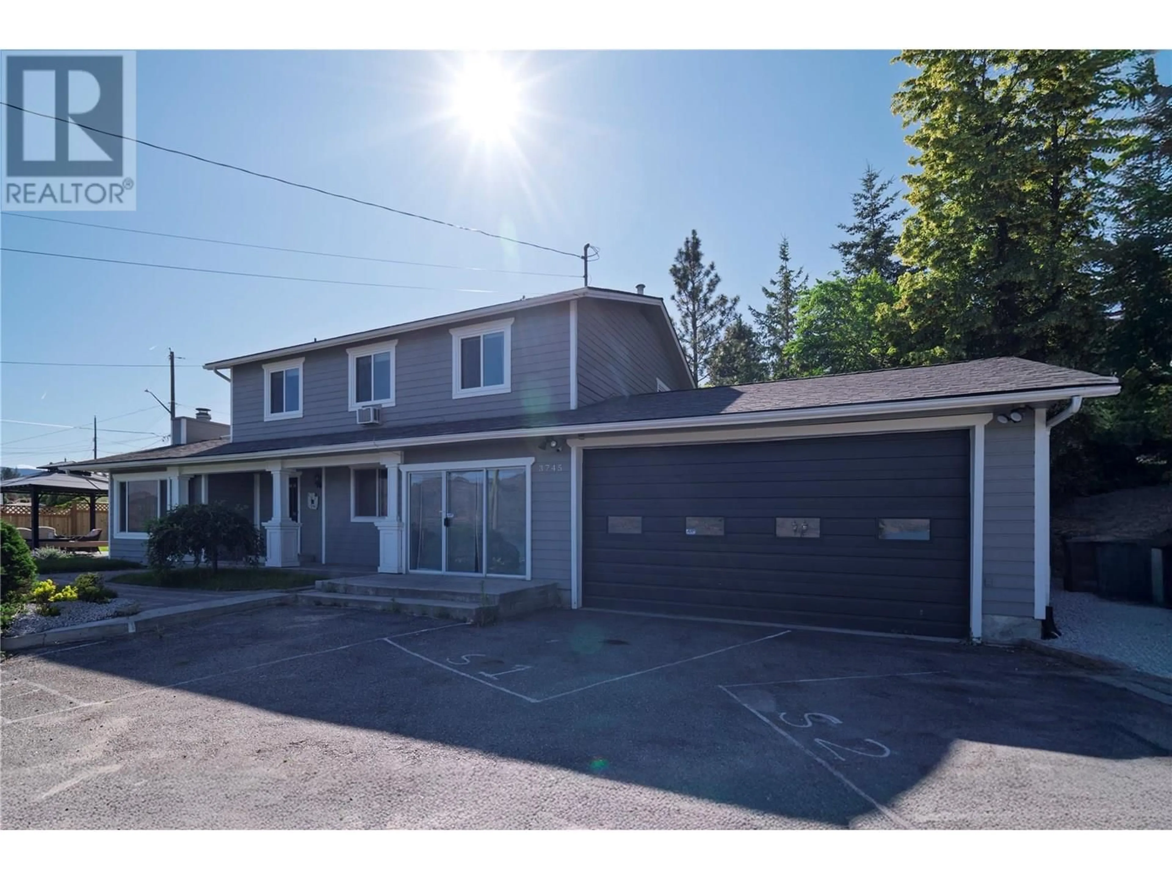 A pic from outside/outdoor area/front of a property/back of a property/a pic from drone, street for 3745 SHAW ROAD, Peachland British Columbia V0H1X2