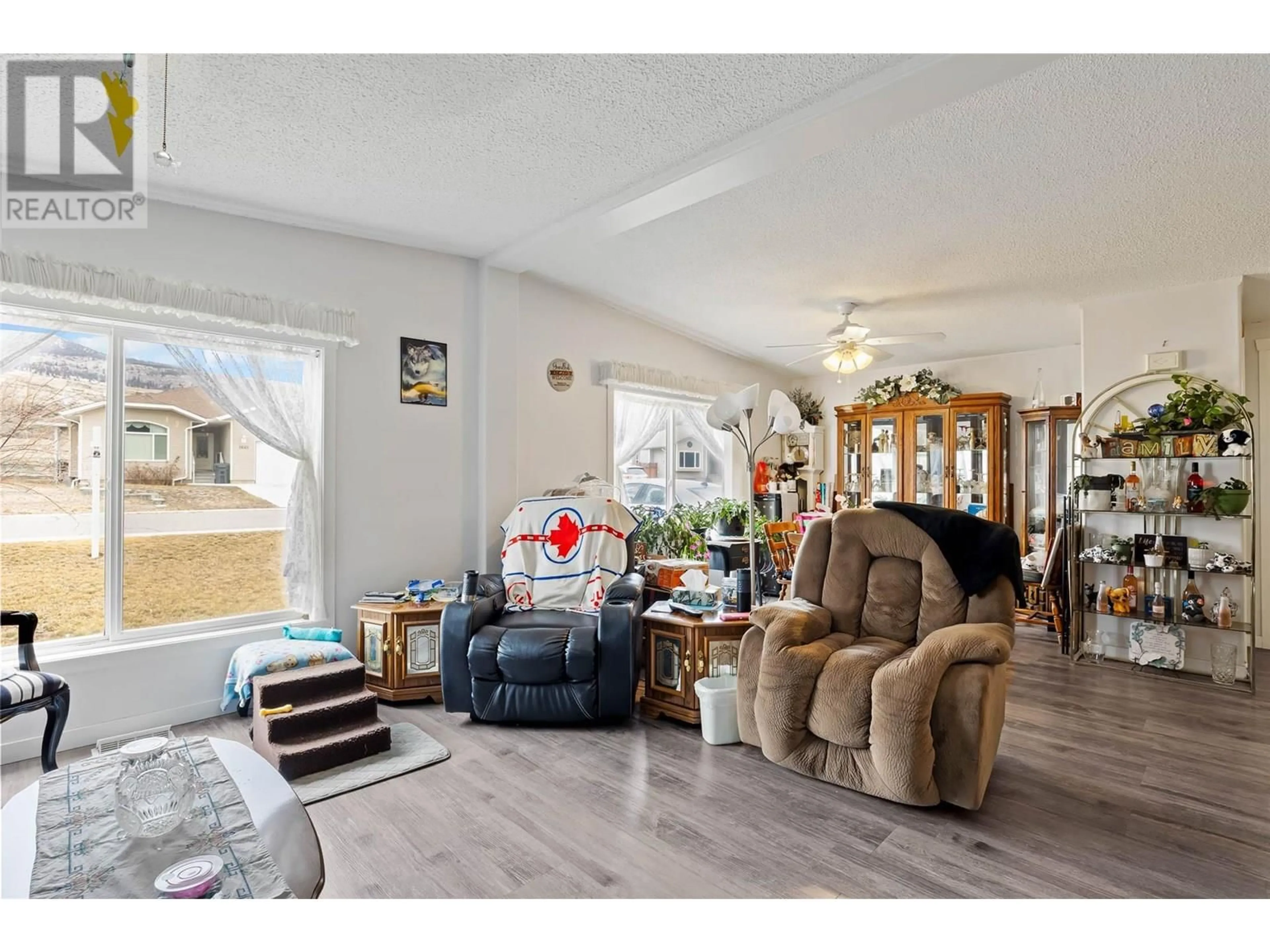 Living room with furniture, wood/laminate floor for 1664 WOODBURN DRIVE, Cache Creek British Columbia V0K1H0