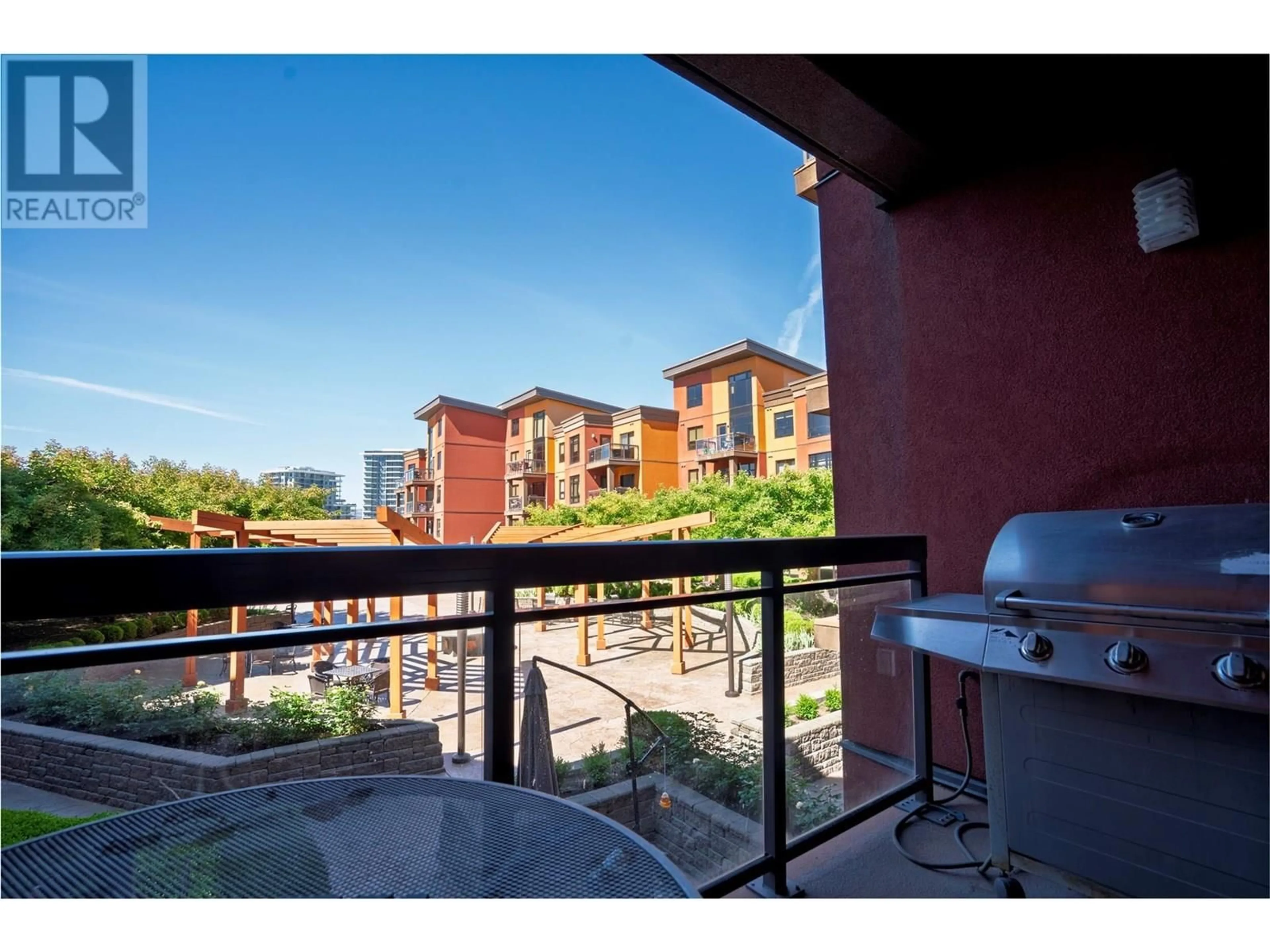 Patio, city buildings view from balcony for 427 - 654 COOK ROAD, Kelowna British Columbia V1W3G7