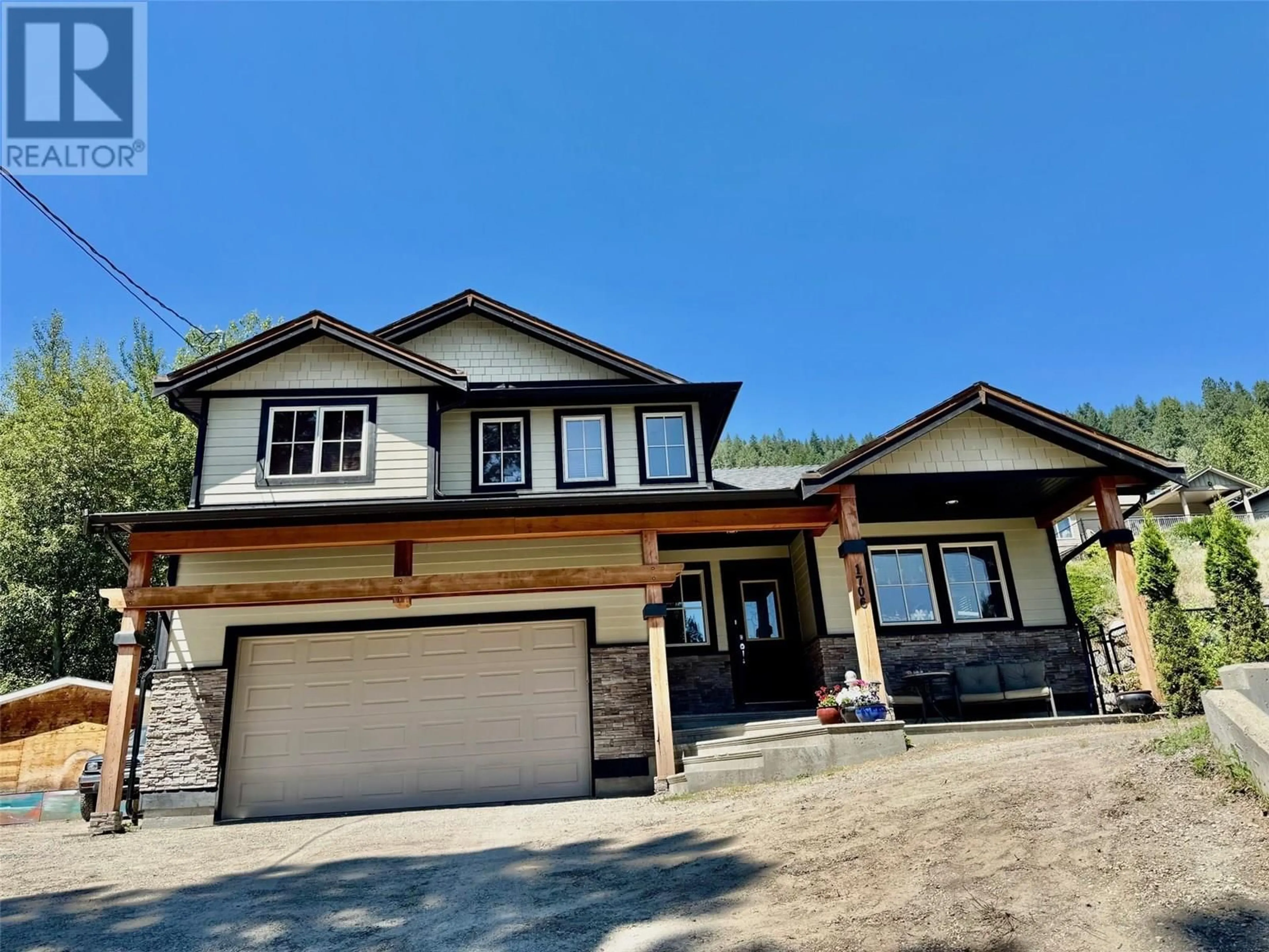 Home with vinyl exterior material, street for 1706 GRANDVIEW AVENUE, Lumby British Columbia V0E2G0