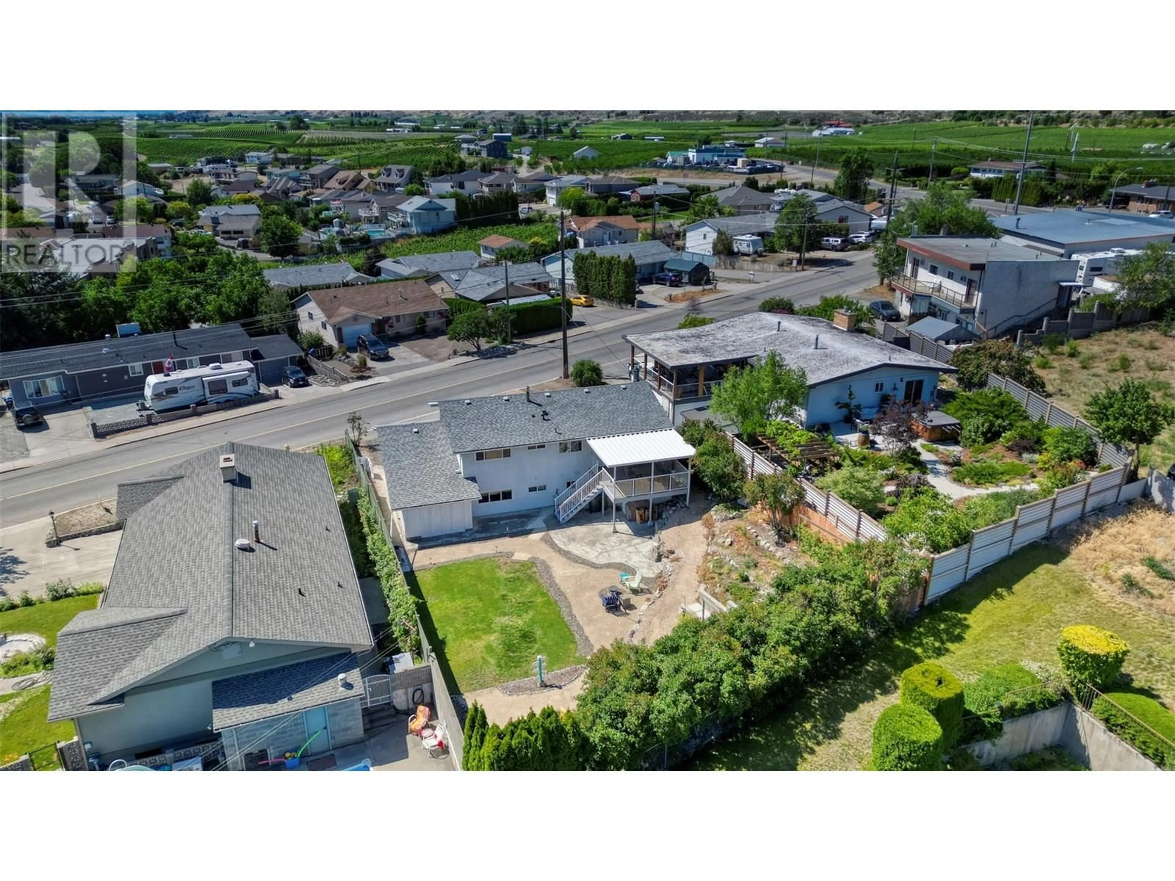 A pic from outside/outdoor area/front of a property/back of a property/a pic from drone, street for 9504 62ND AVENUE, Osoyoos British Columbia V0H1V1