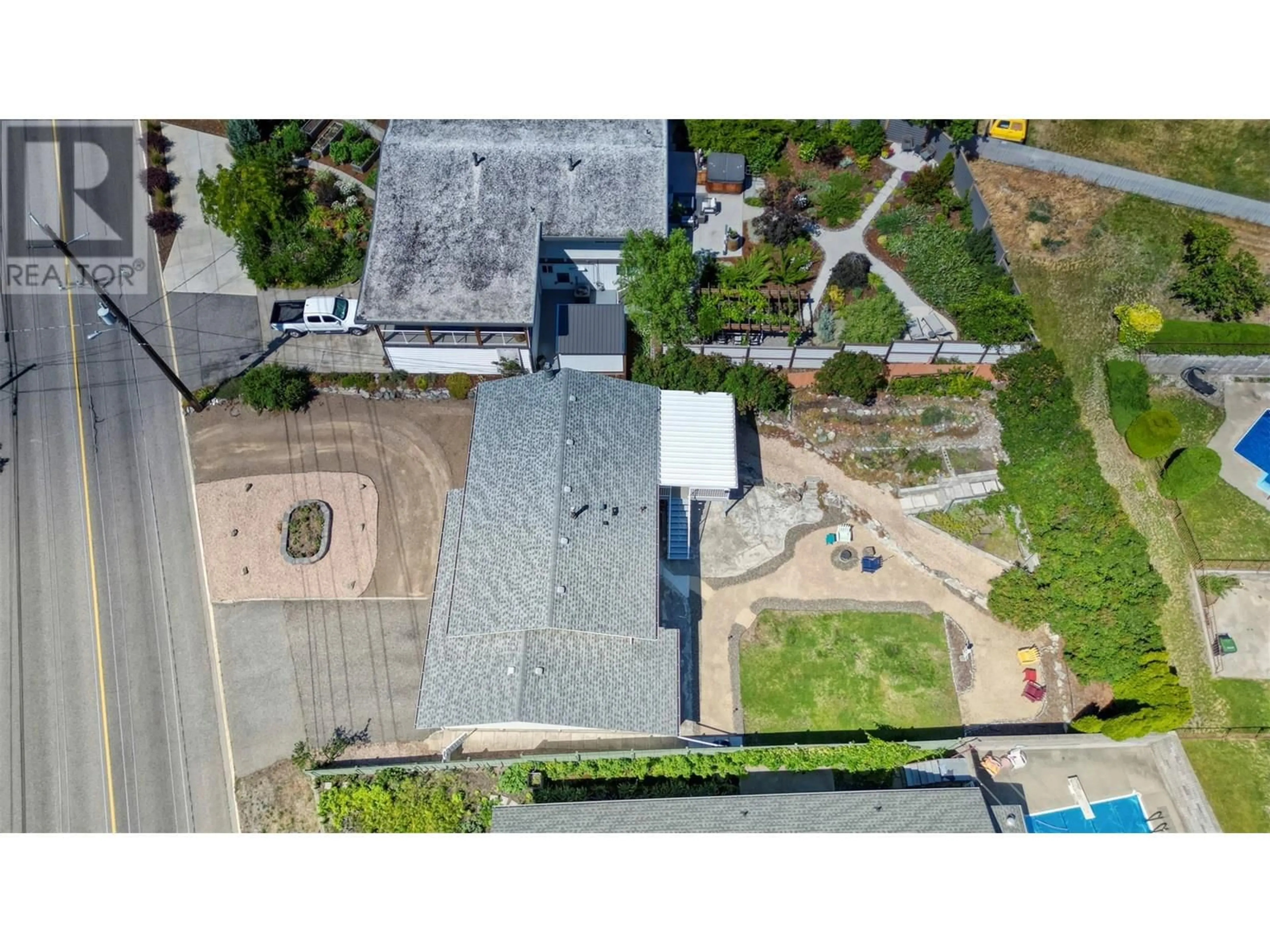 A pic from outside/outdoor area/front of a property/back of a property/a pic from drone, street for 9504 62ND AVENUE, Osoyoos British Columbia V0H1V1