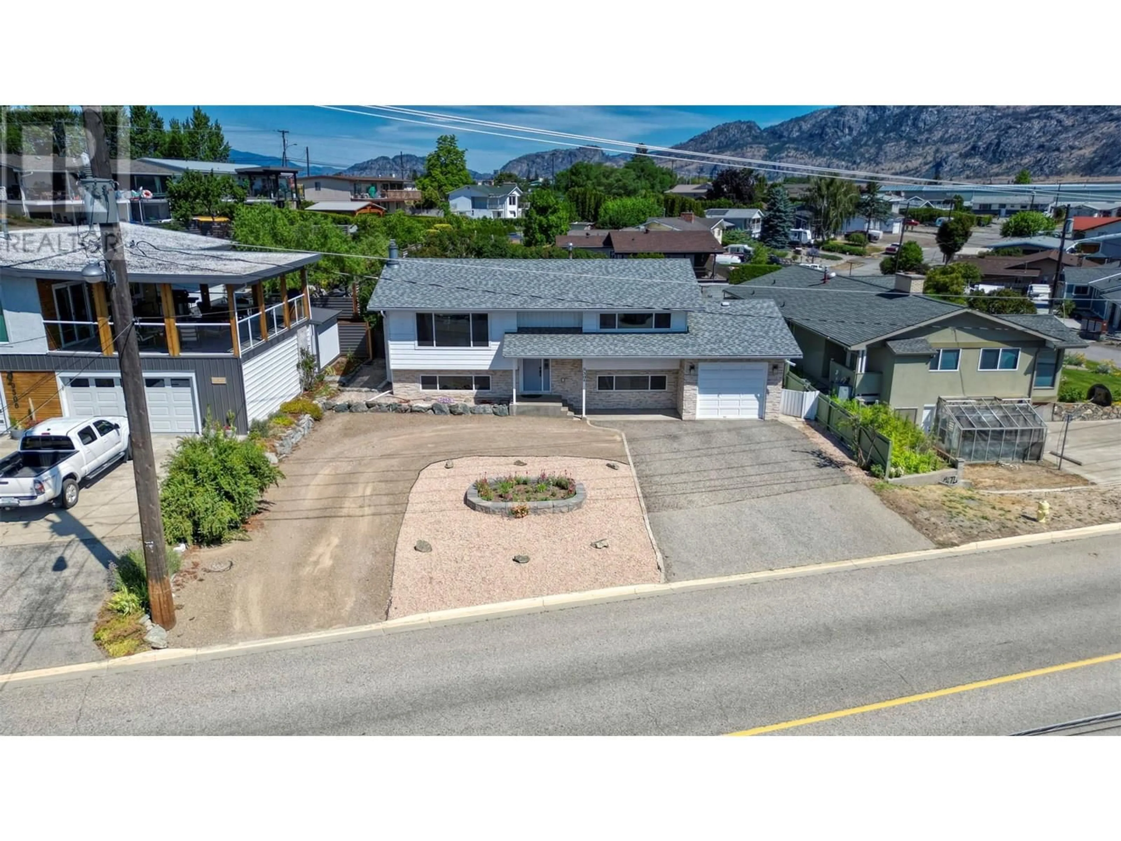 A pic from outside/outdoor area/front of a property/back of a property/a pic from drone, street for 9504 62ND AVENUE, Osoyoos British Columbia V0H1V1