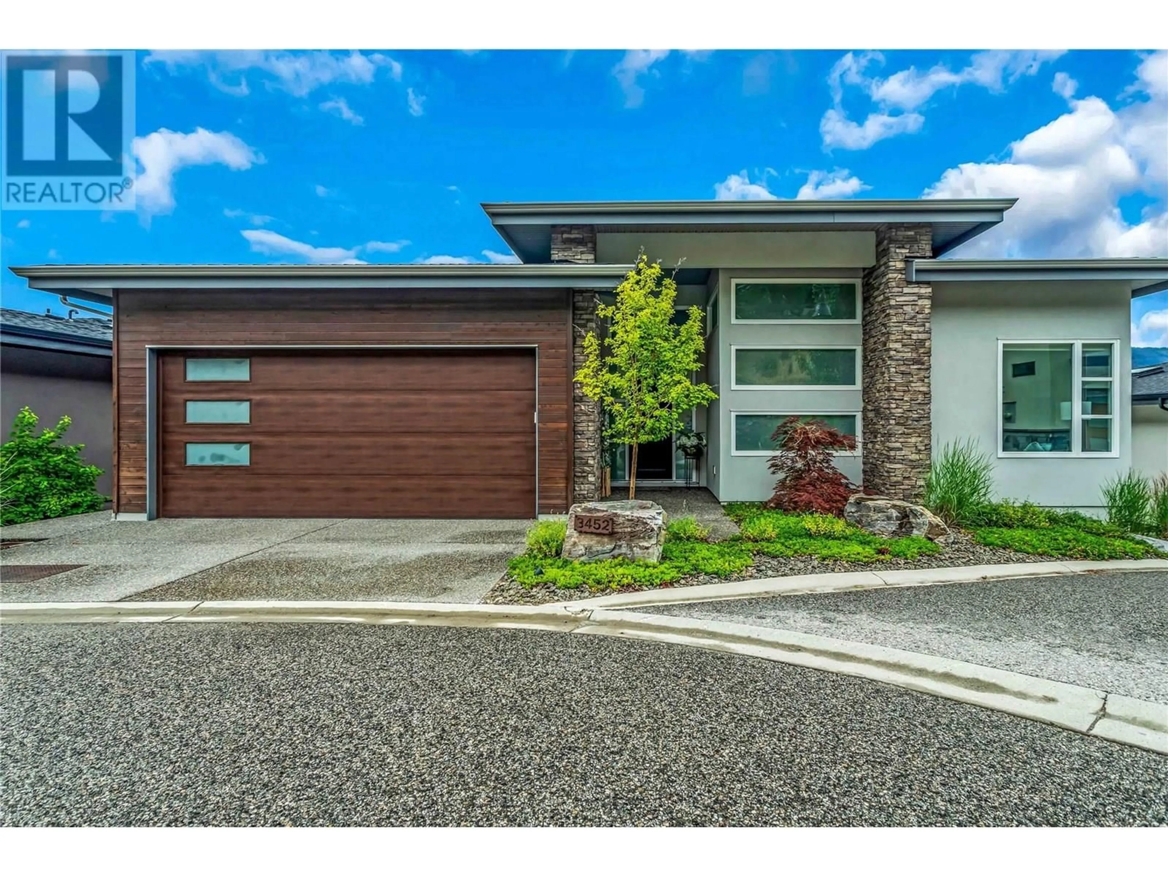 Home with brick exterior material, street for 3452 BLUE GRASS LANE, Kelowna British Columbia V1V3G1