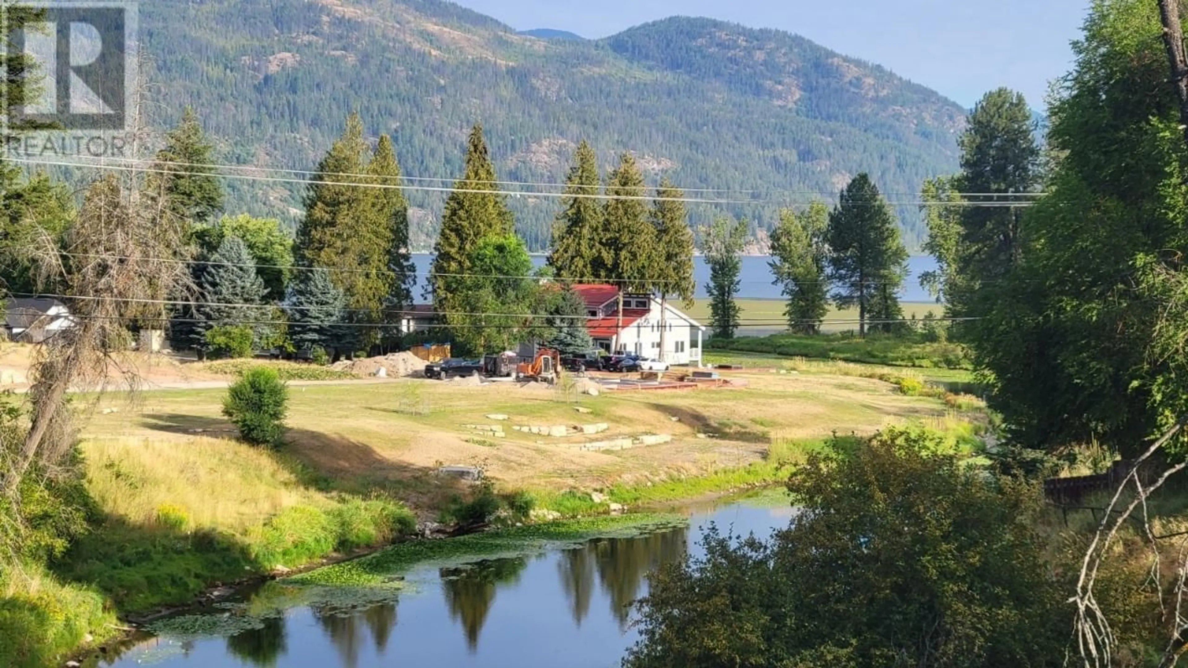 A pic from outside/outdoor area/front of a property/back of a property/a pic from drone, water/lake/river/ocean view for 1650 BENNIGER ROAD, Christina Lake British Columbia V0H1E0
