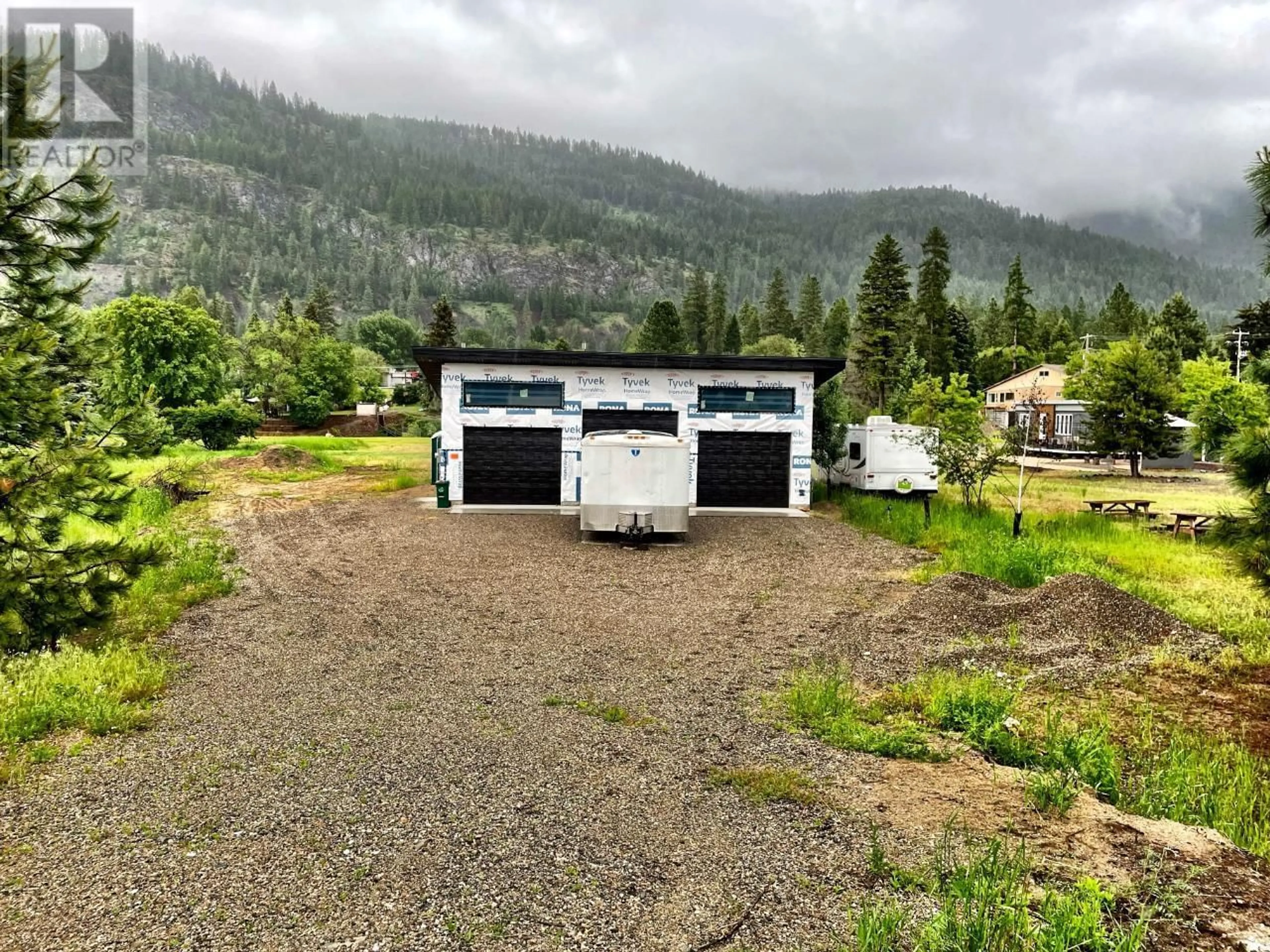 A pic from outside/outdoor area/front of a property/back of a property/a pic from drone, mountain view for 1650 BENNIGER ROAD, Christina Lake British Columbia V0H1E0