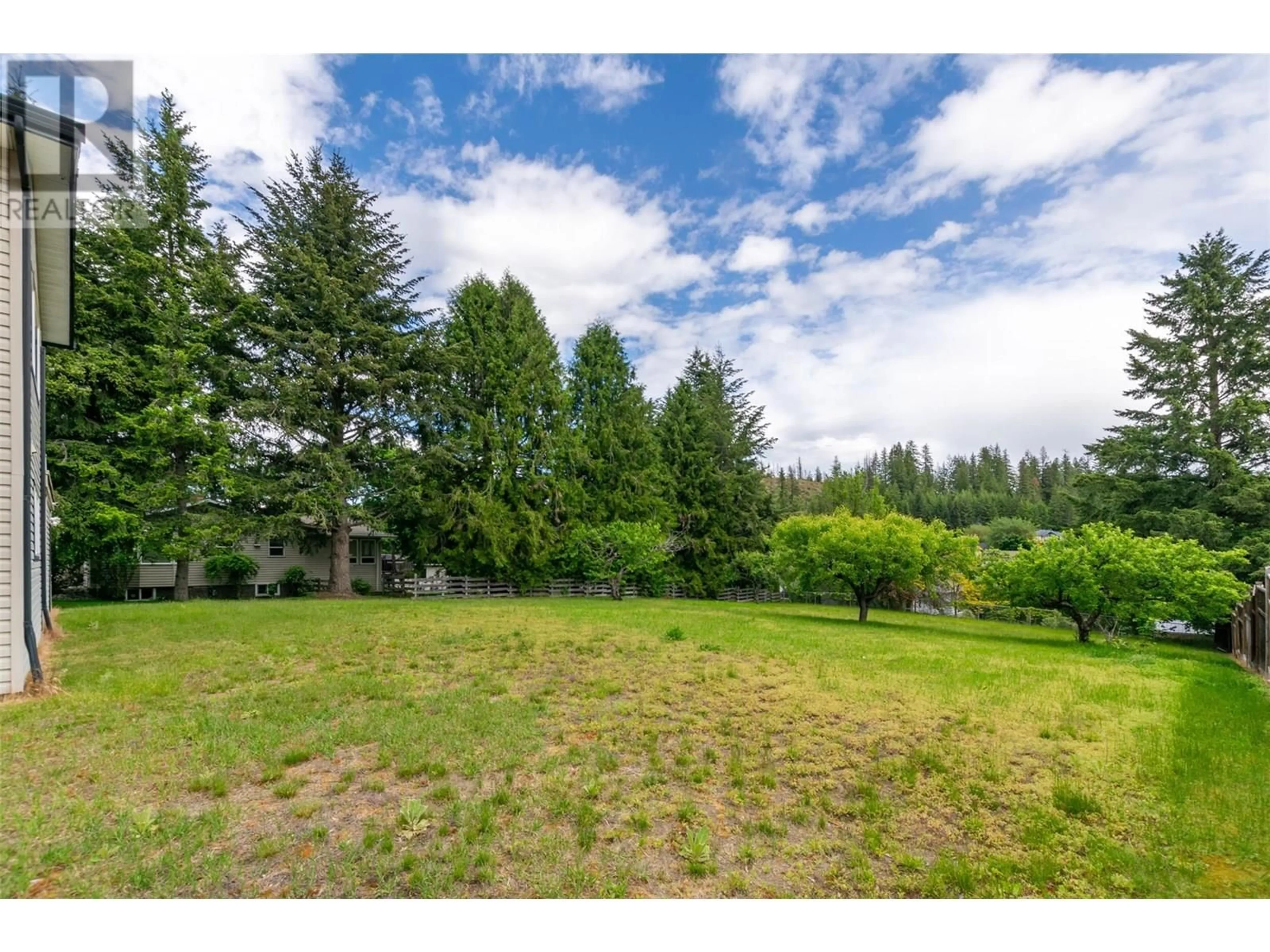 A pic from outside/outdoor area/front of a property/back of a property/a pic from drone, forest/trees view for 860 33 STREET SOUTHEAST, Salmon Arm British Columbia V1E2C5