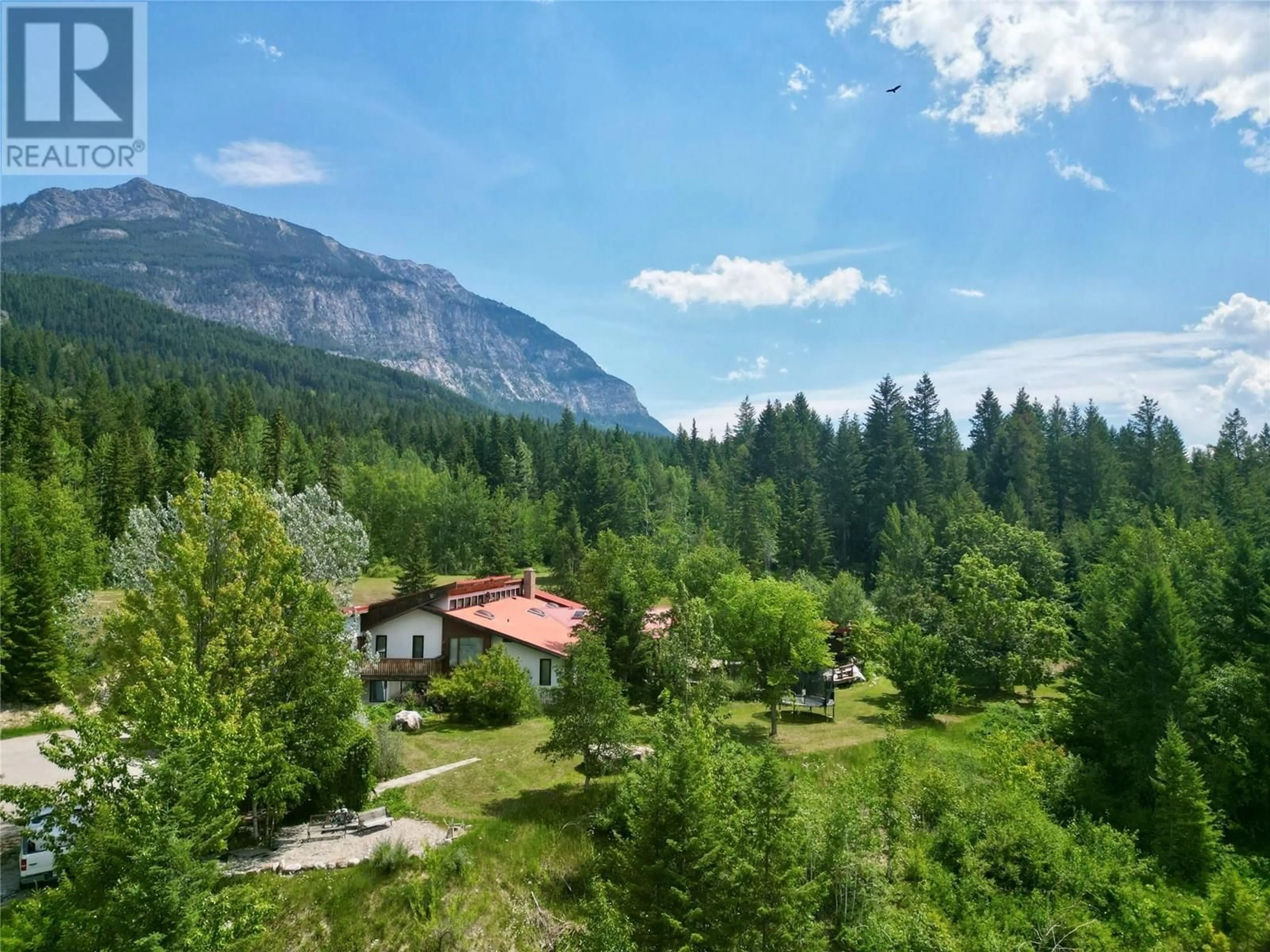 A pic from outside/outdoor area/front of a property/back of a property/a pic from drone, mountain view for 1297 CAMPBELL ROAD, Golden British Columbia V0A1H7