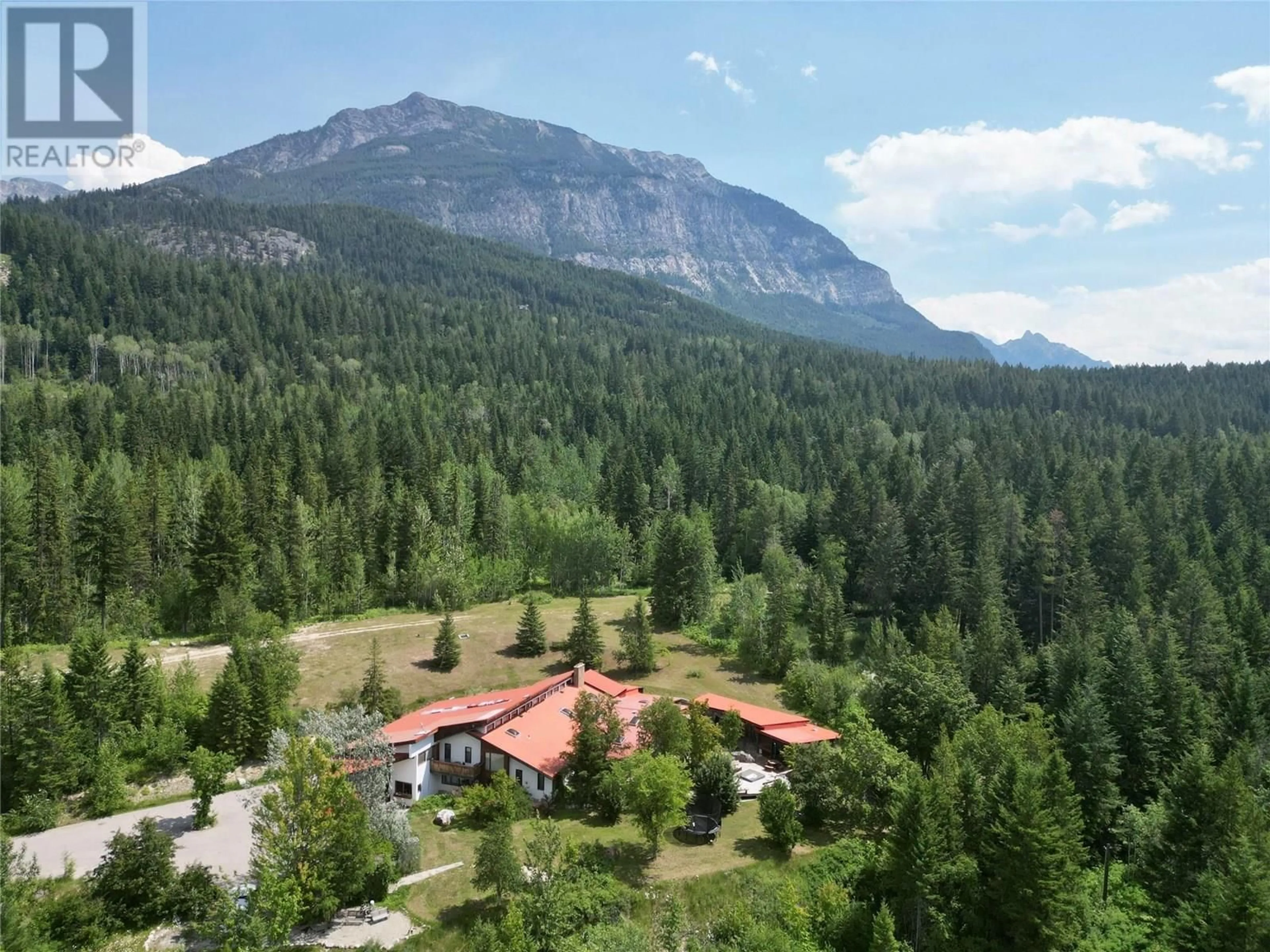 A pic from outside/outdoor area/front of a property/back of a property/a pic from drone, mountain view for 1297 CAMPBELL ROAD, Golden British Columbia V0A1H7