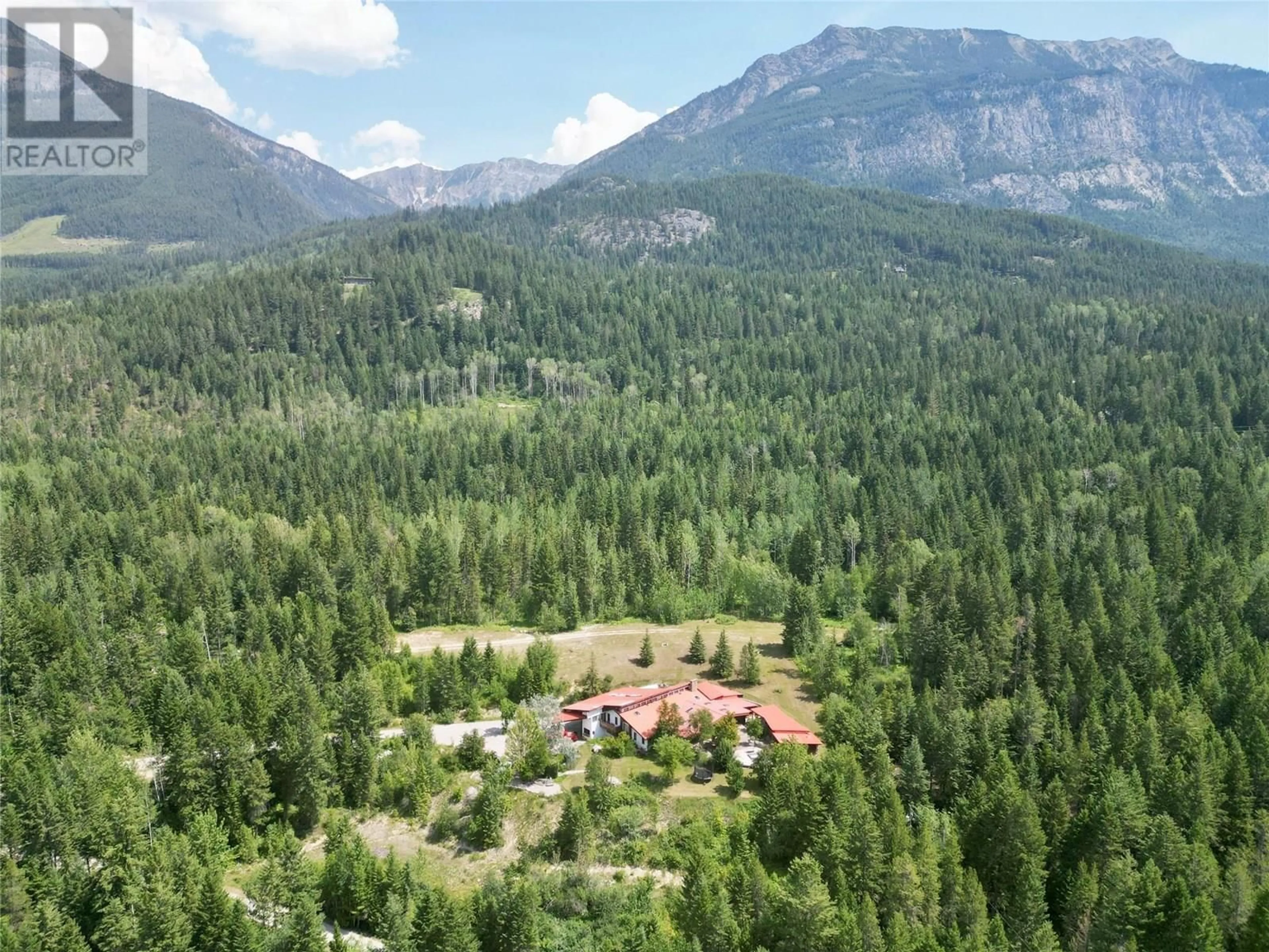A pic from outside/outdoor area/front of a property/back of a property/a pic from drone, mountain view for 1297 CAMPBELL ROAD, Golden British Columbia V0A1H7