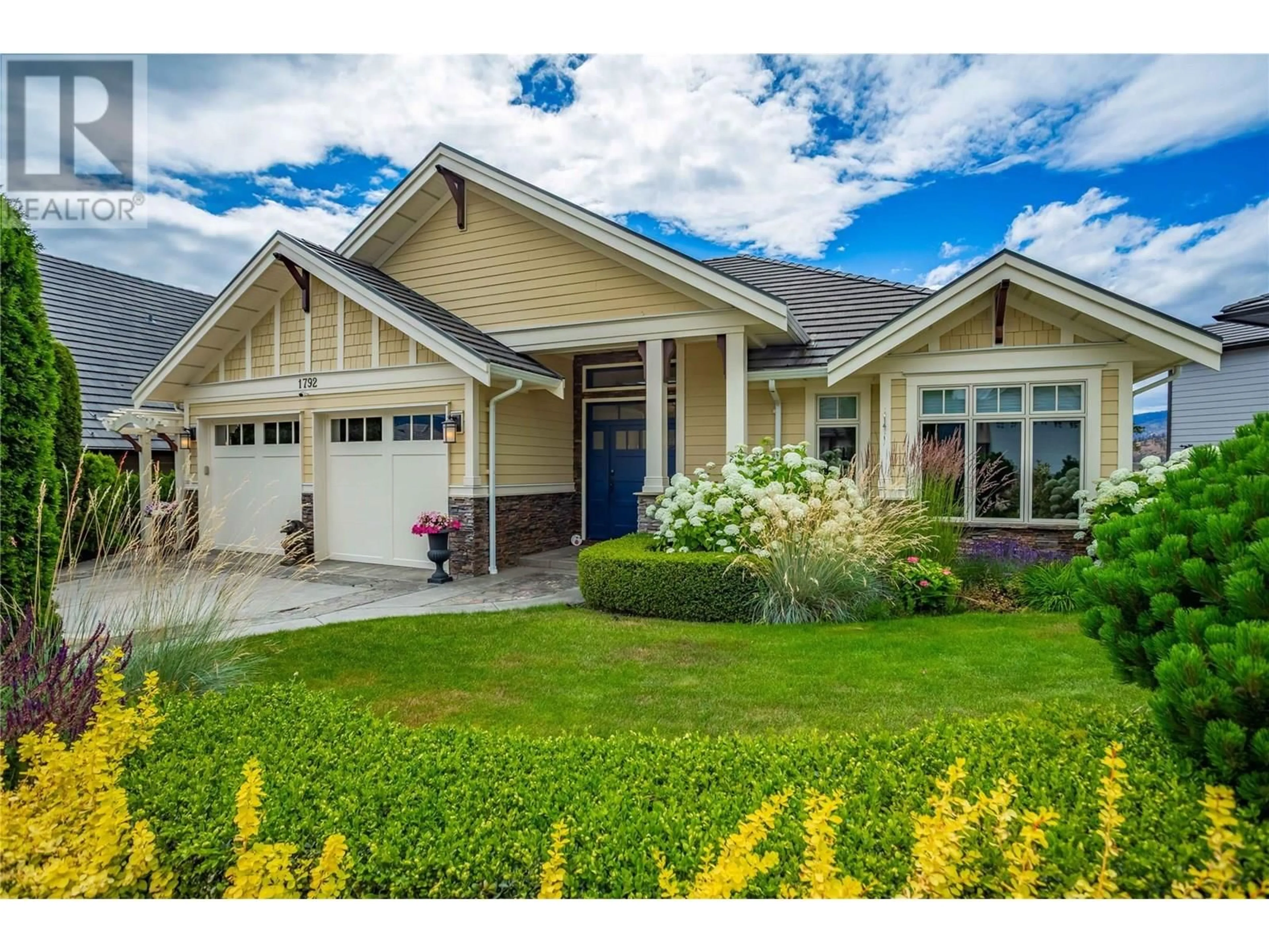 Home with vinyl exterior material, street for 1792 CAPISTRANO PEAKS CRESCENT, Kelowna British Columbia V1V2N1