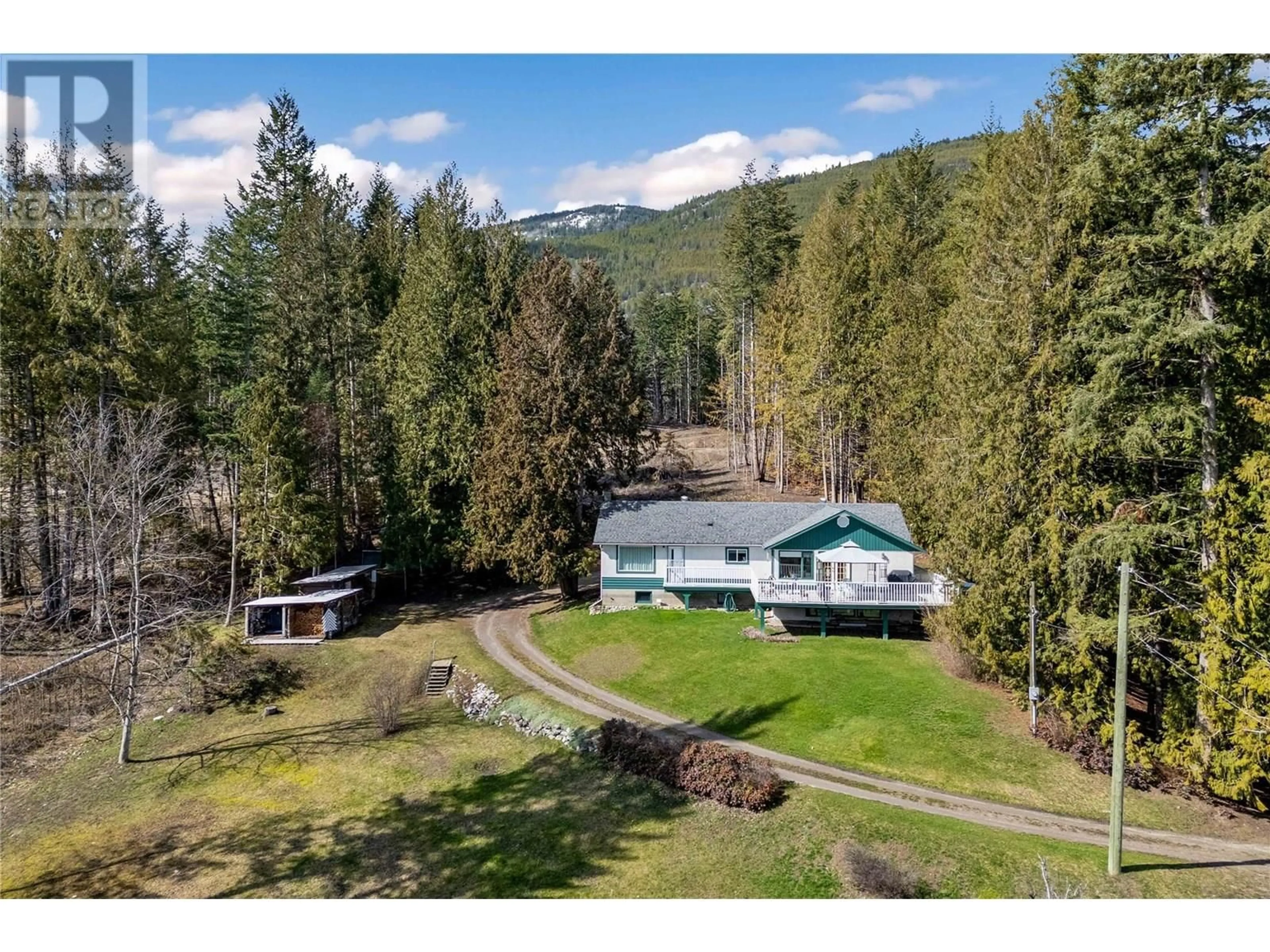 A pic from outside/outdoor area/front of a property/back of a property/a pic from drone, mountain view for 701 CHRISTISON ROAD SOUTHWEST, Salmon Arm British Columbia V1E3B4