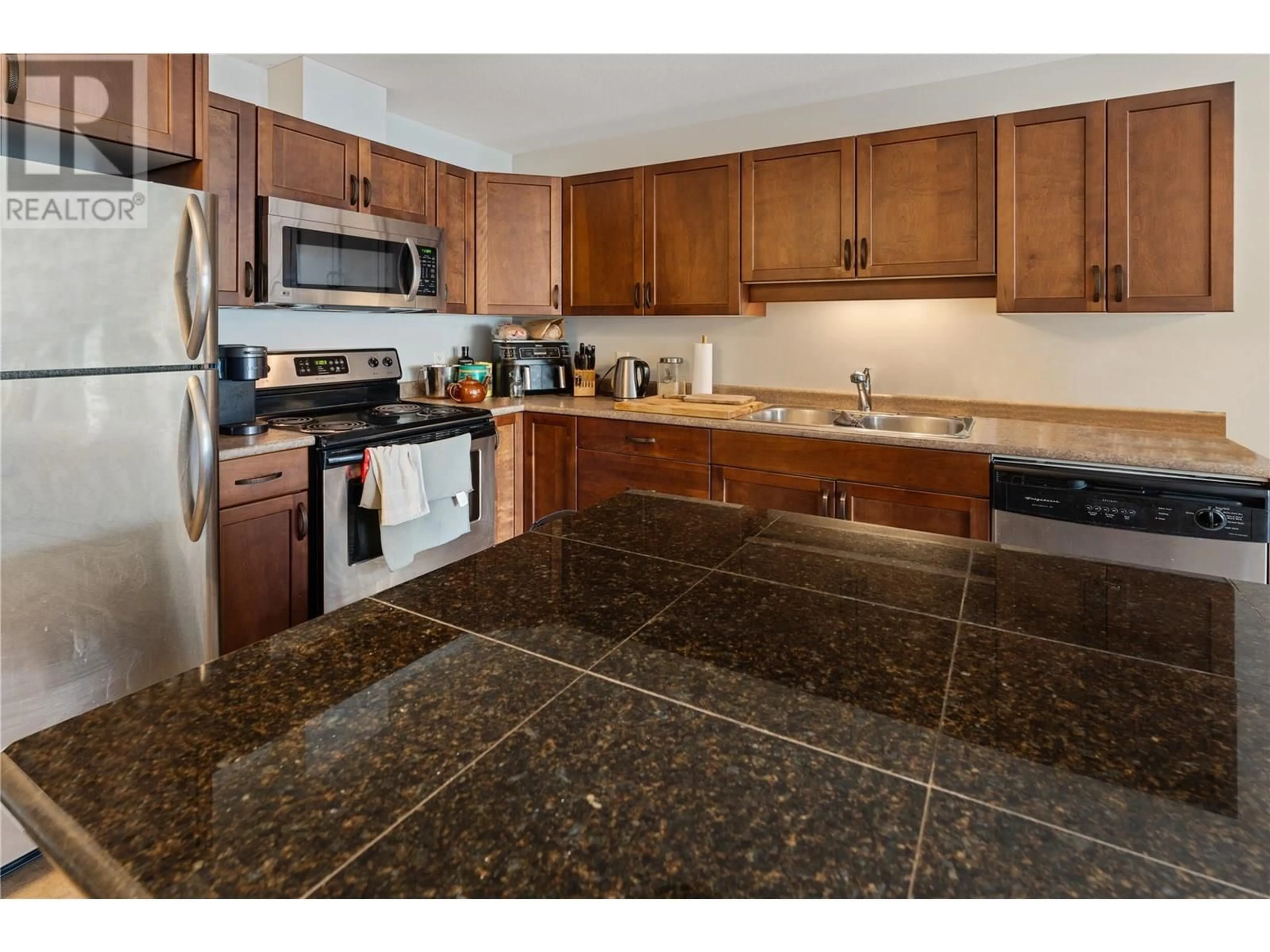 Standard kitchen, ceramic/tile floor for 406 - 3350 WOODSDALE ROAD, Lake Country British Columbia V4V2R7
