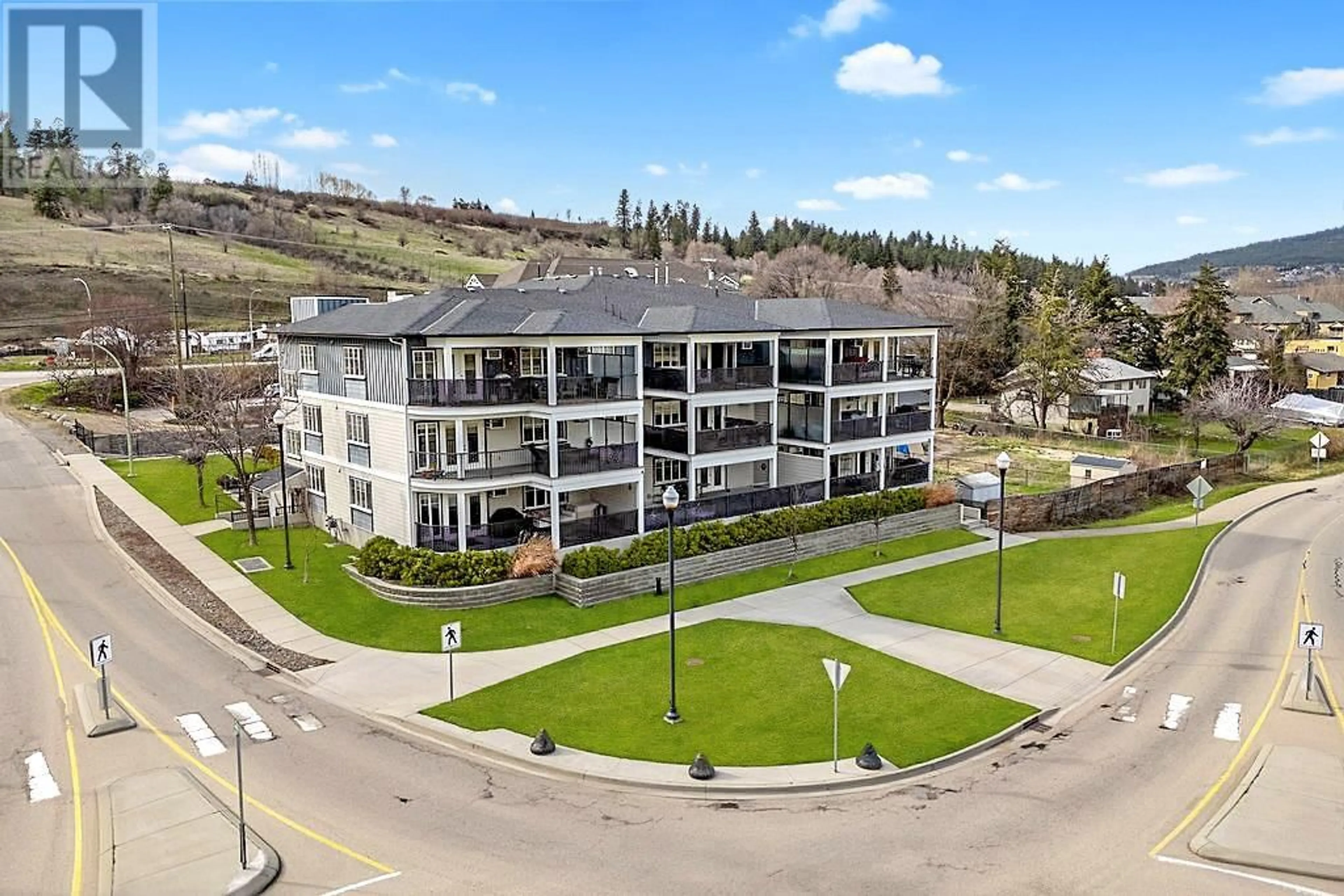 A pic from outside/outdoor area/front of a property/back of a property/a pic from drone, mountain view for 101 - 10529 POWLEY COURT, Lake Country British Columbia V4V2S2