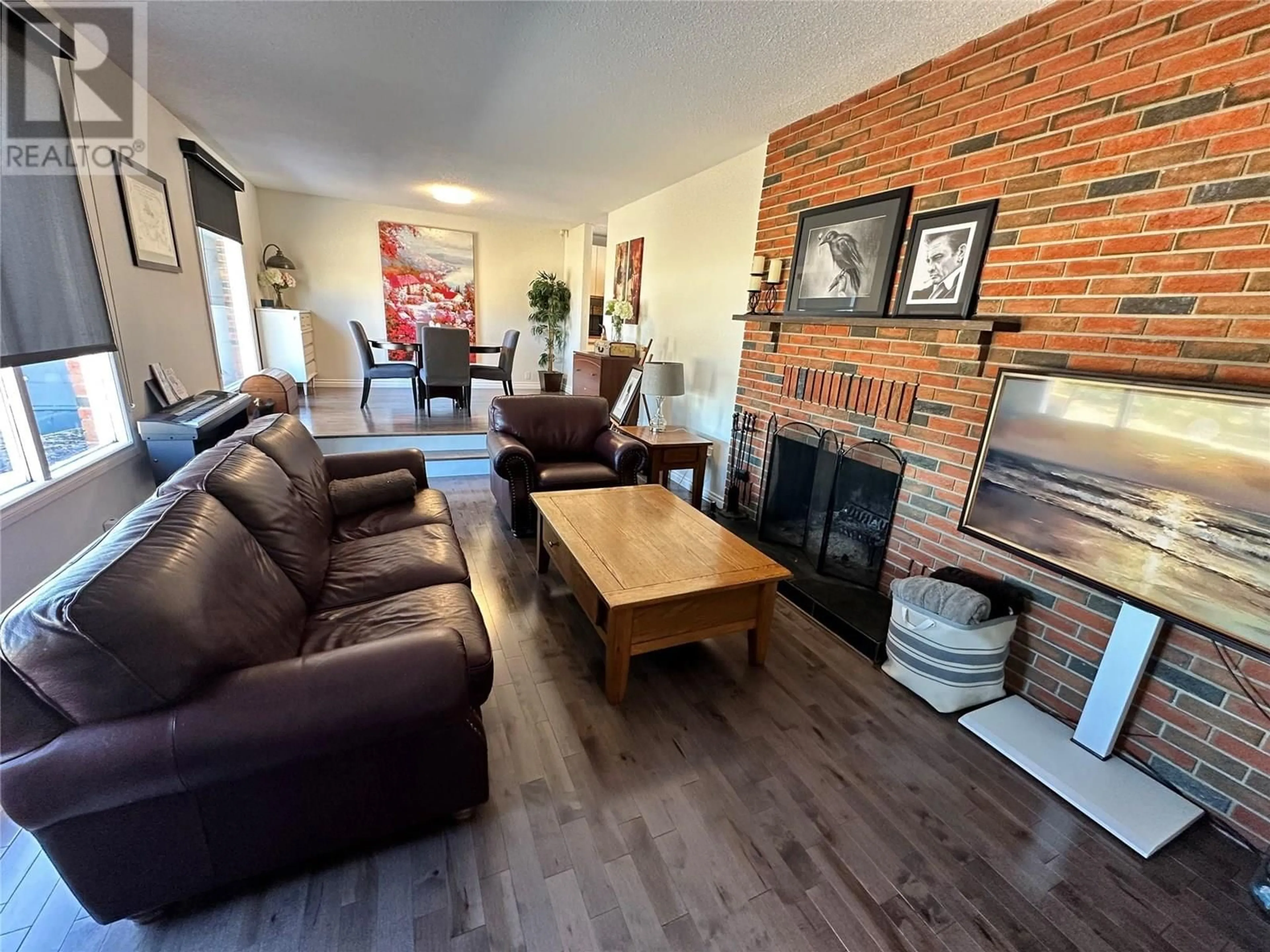Living room with furniture, wood/laminate floor for 13065 219 ROAD, Dawson Creek British Columbia V1G1C0