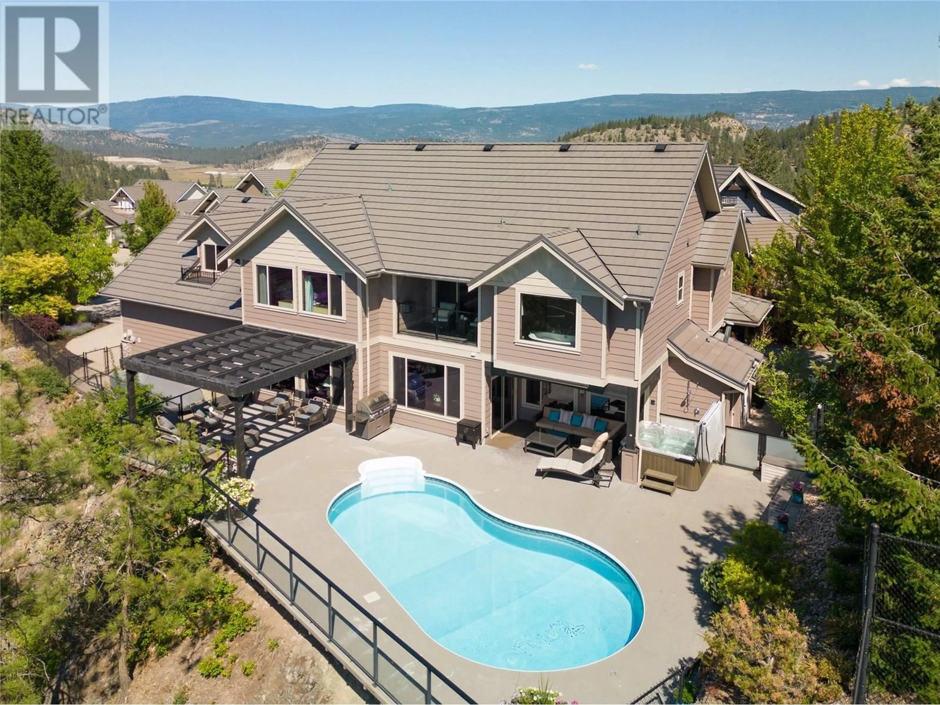 A pic from outside/outdoor area/front of a property/back of a property/a pic from drone, mountain view for 854 BIG ROCK COURT, Kelowna British Columbia V1V2S1