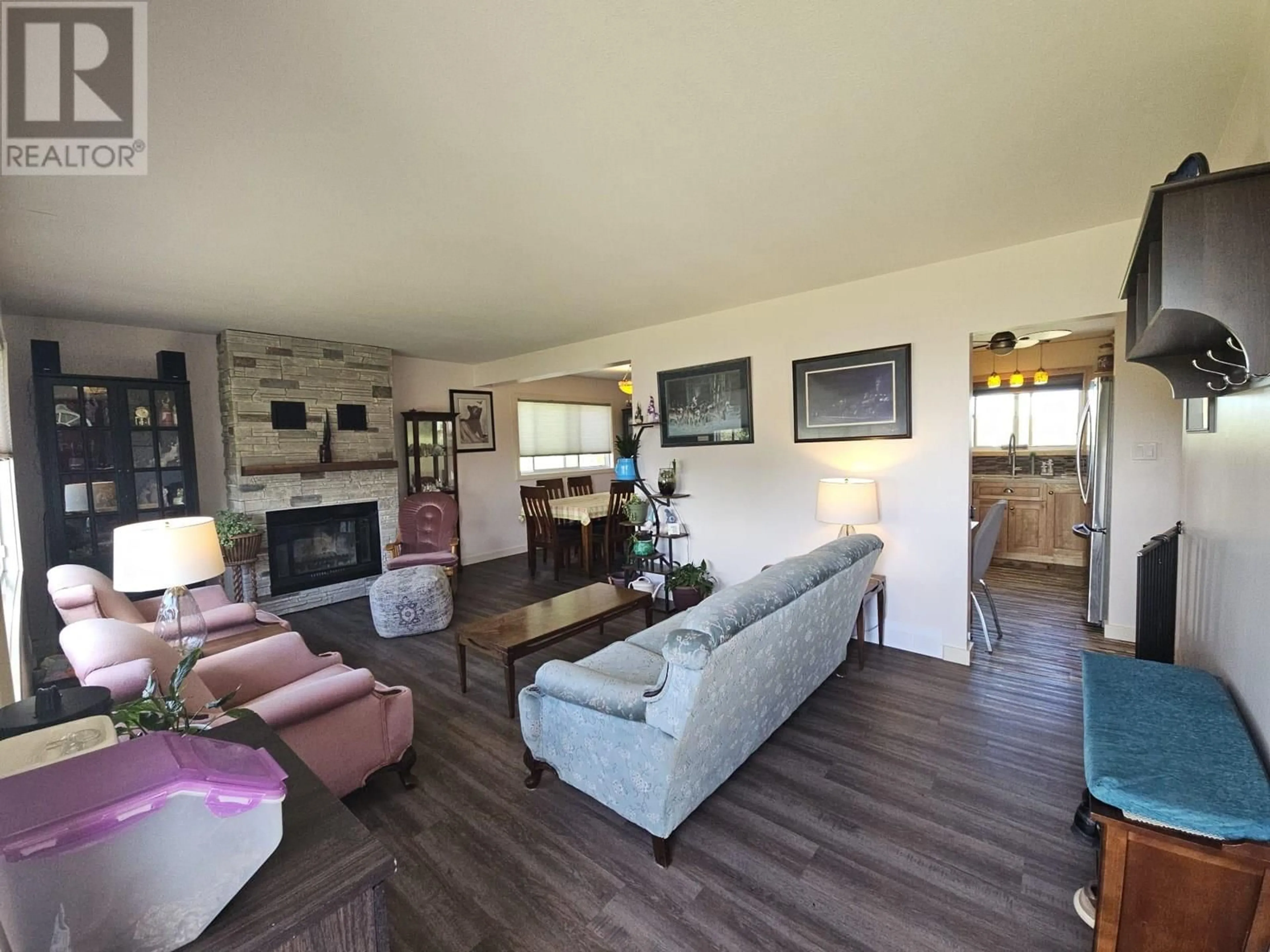 Living room with furniture, wood/laminate floor for 9220 6 STREET, Dawson Creek British Columbia V1G3L6