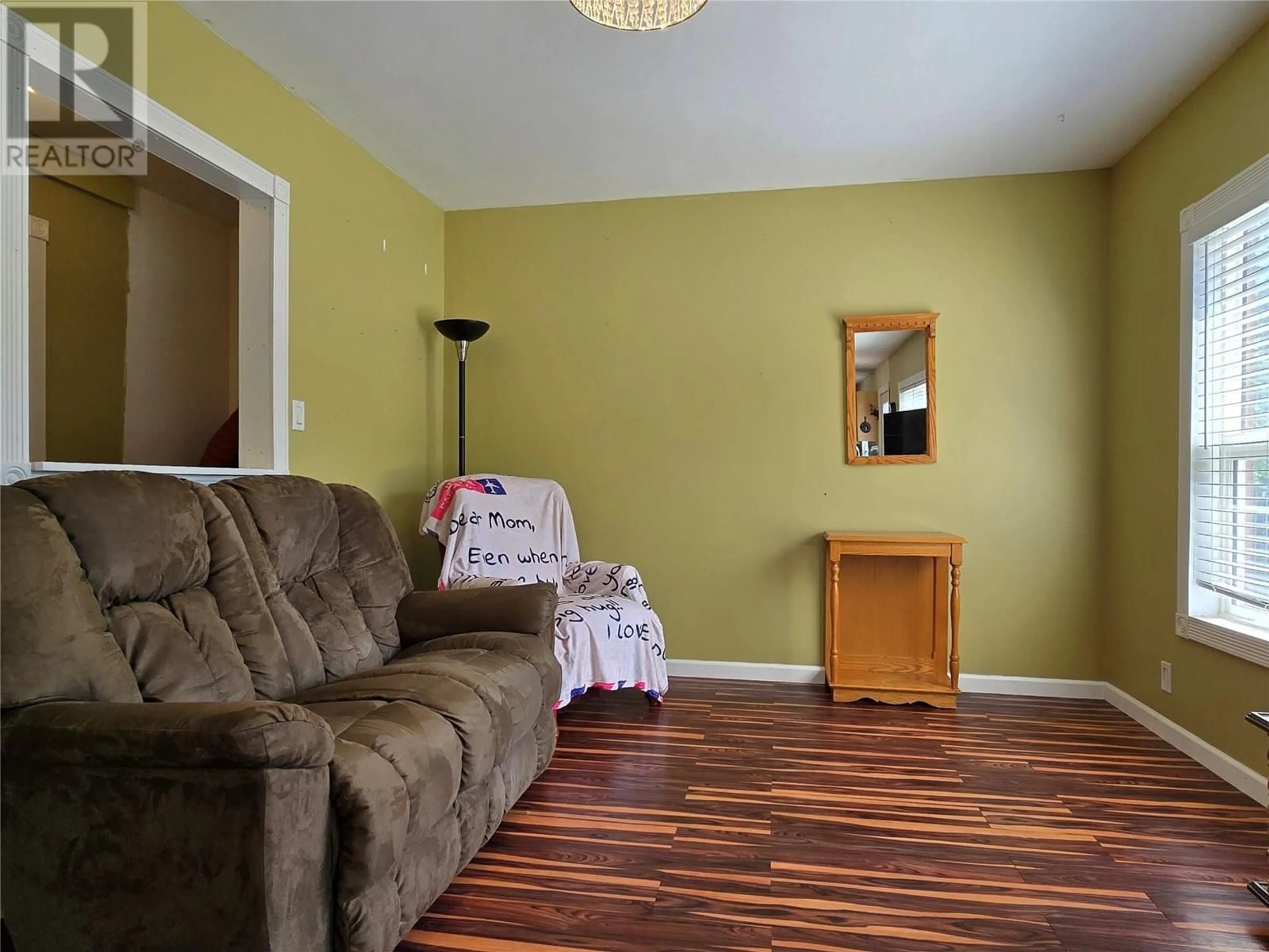 Living room with furniture, wood/laminate floor for 1403 SOUES STREET, Clinton British Columbia V0K1K0