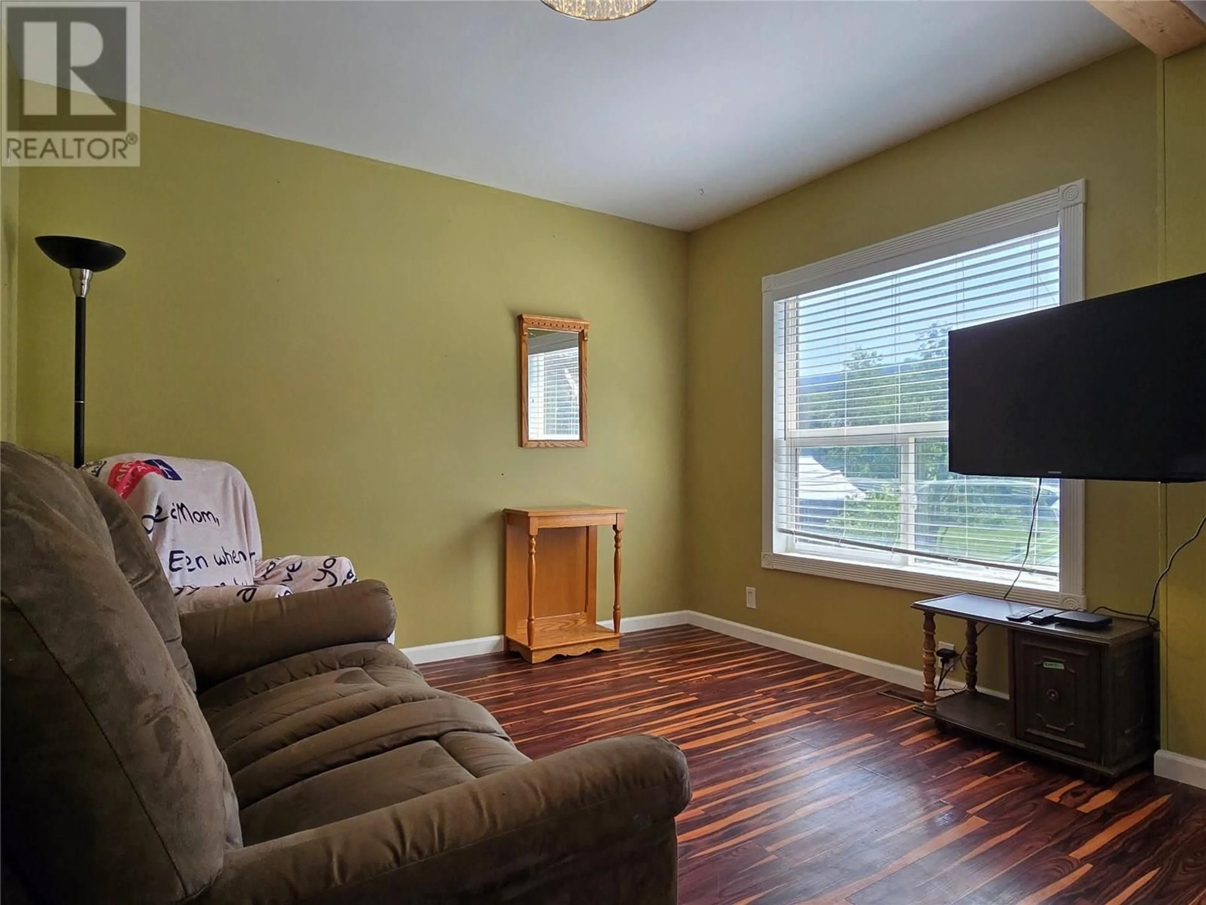 Living room with furniture, wood/laminate floor for 1403 SOUES STREET, Clinton British Columbia V0K1K0