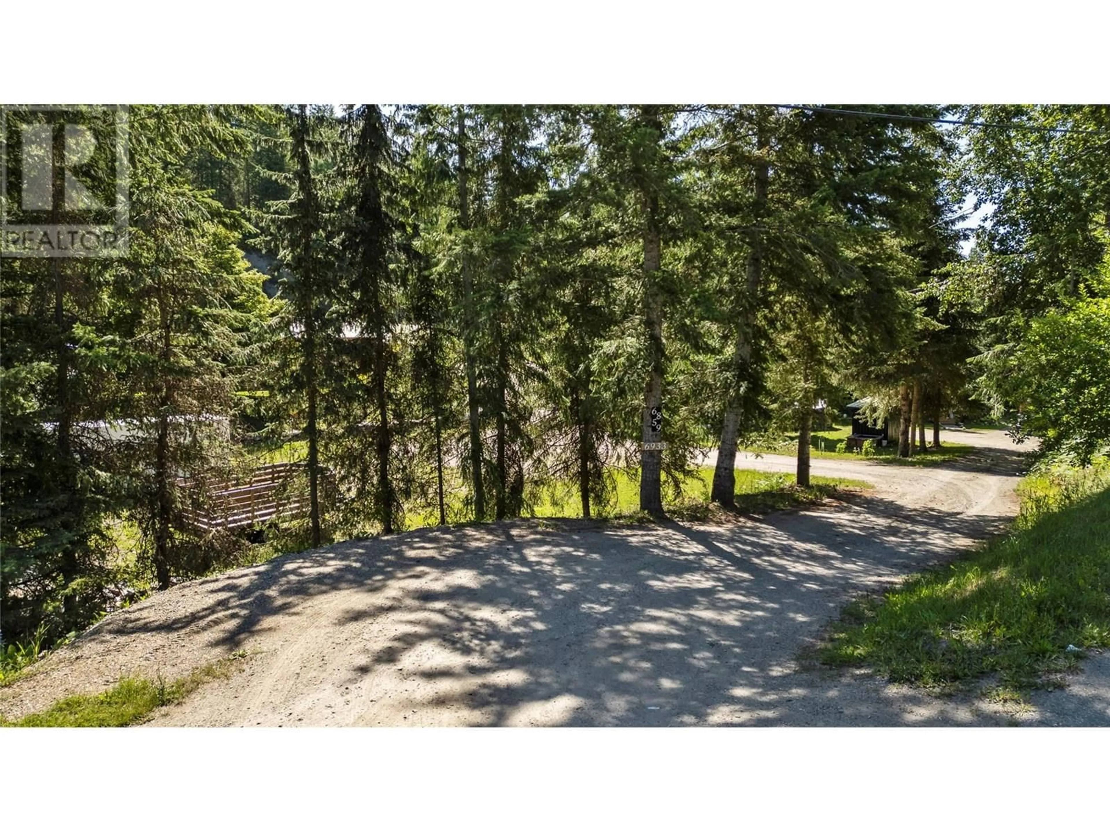 A pic from outside/outdoor area/front of a property/back of a property/a pic from drone, forest/trees view for 6859 RANCHERO DRIVE EAST, Salmon Arm British Columbia V1E2Y5