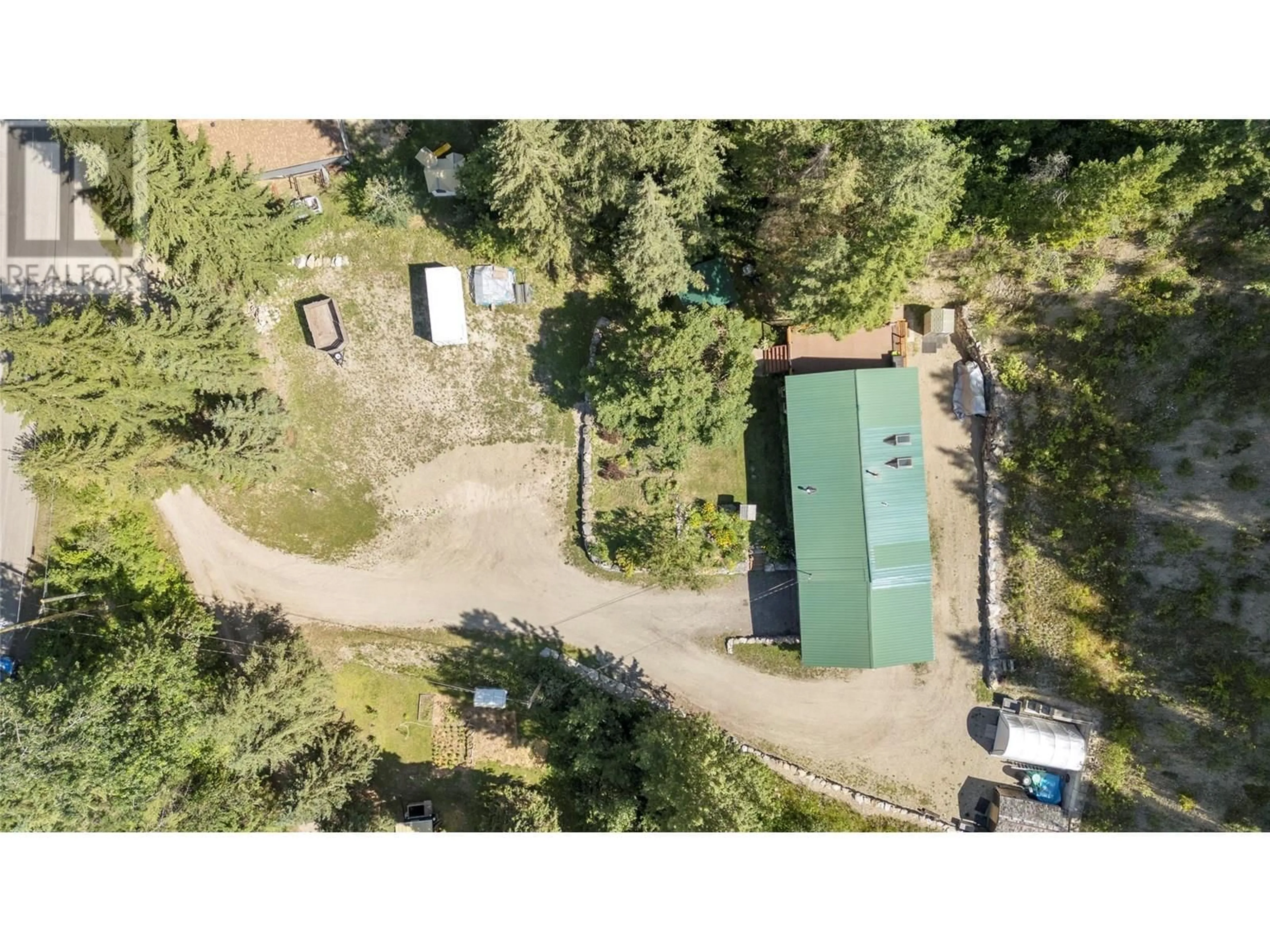 A pic from outside/outdoor area/front of a property/back of a property/a pic from drone, forest/trees view for 6859 RANCHERO DRIVE EAST, Salmon Arm British Columbia V1E2Y5