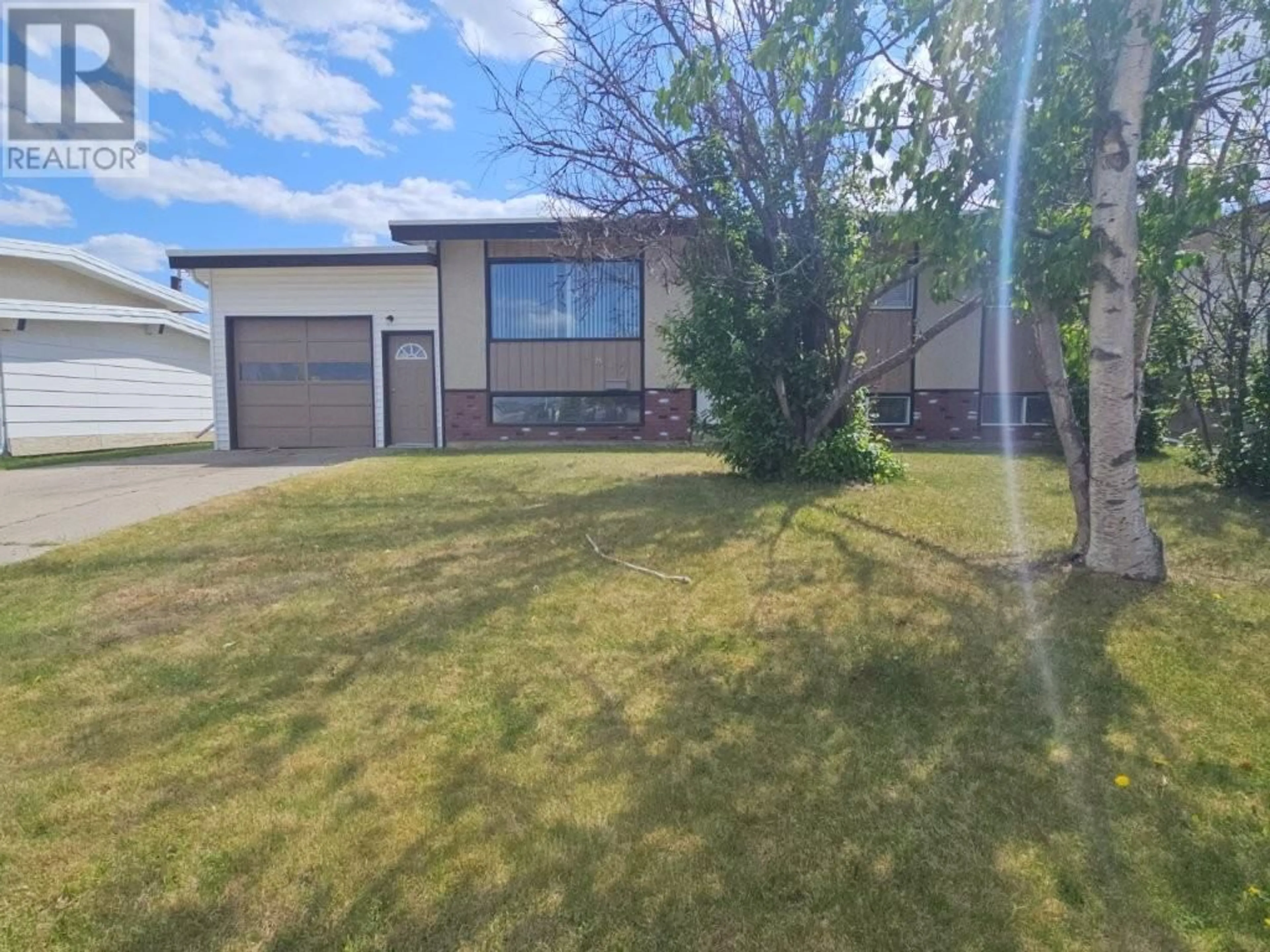 A pic from outside/outdoor area/front of a property/back of a property/a pic from drone, street for 1817 ASPEN DRIVE, Dawson Creek British Columbia V1G2S5
