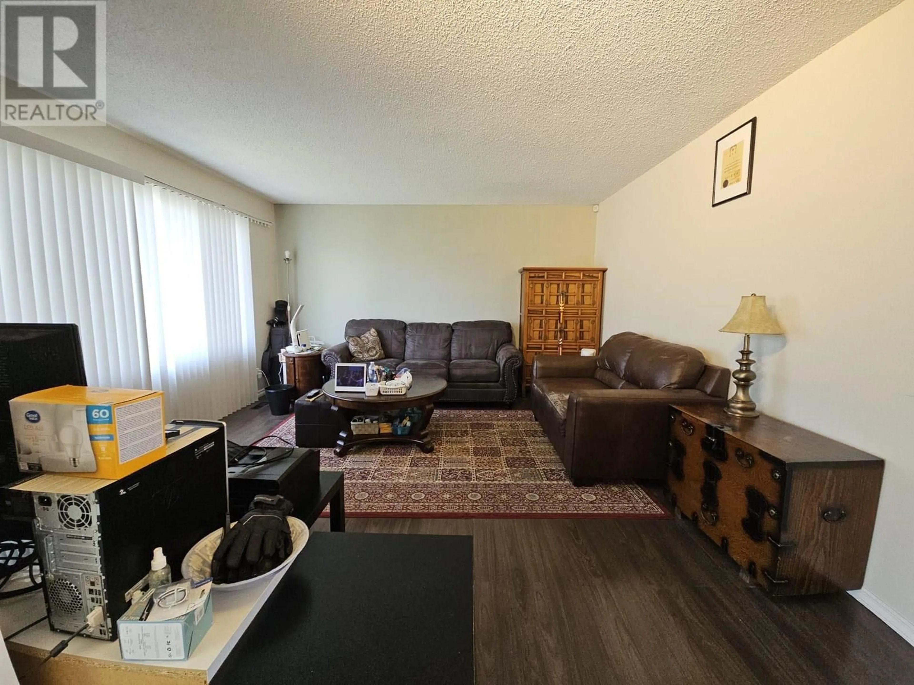 Living room with furniture, wood/laminate floor for 1817 ASPEN DRIVE, Dawson Creek British Columbia V1G2S5