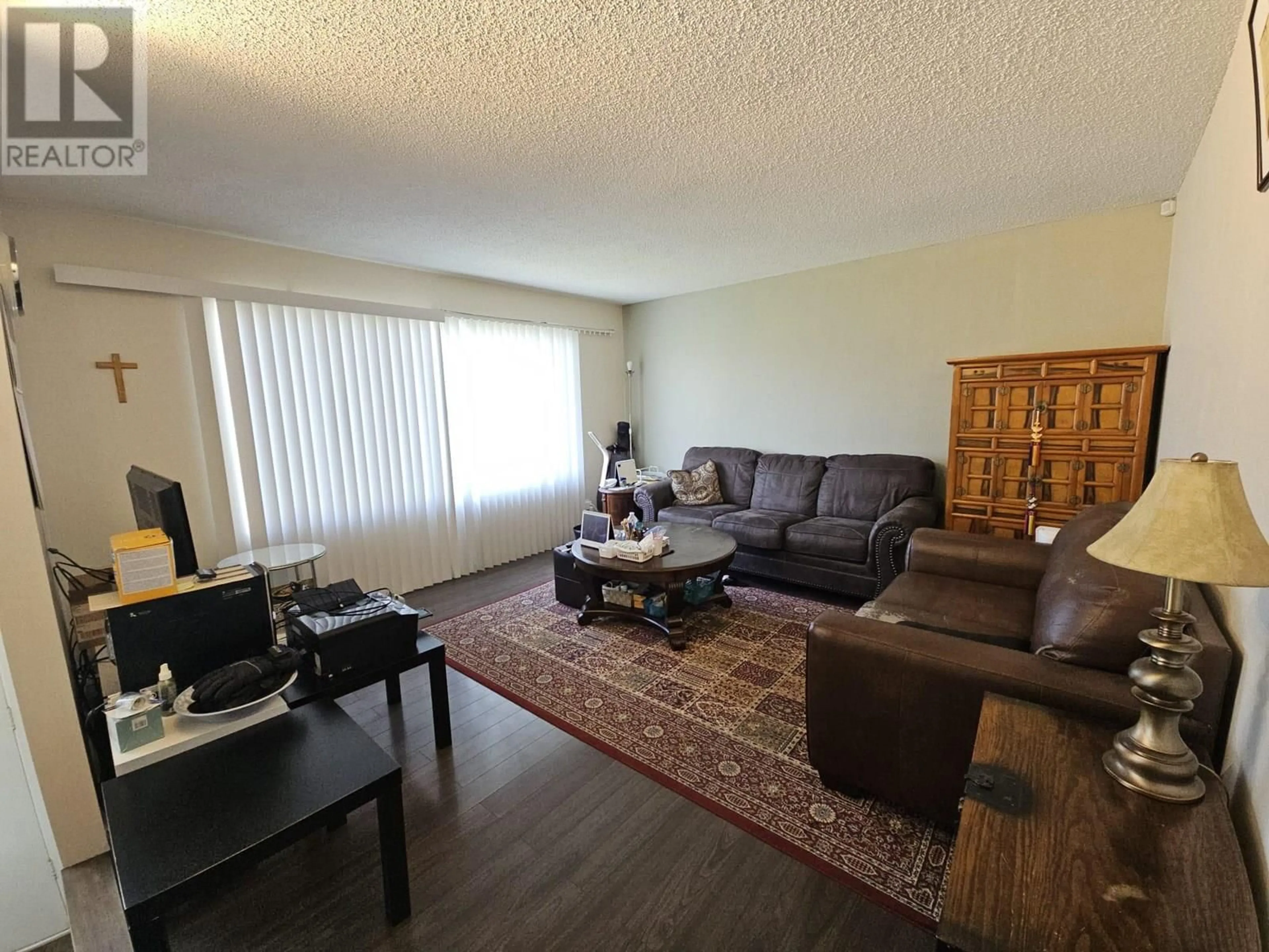 Living room with furniture, wood/laminate floor for 1817 ASPEN DRIVE, Dawson Creek British Columbia V1G2S5