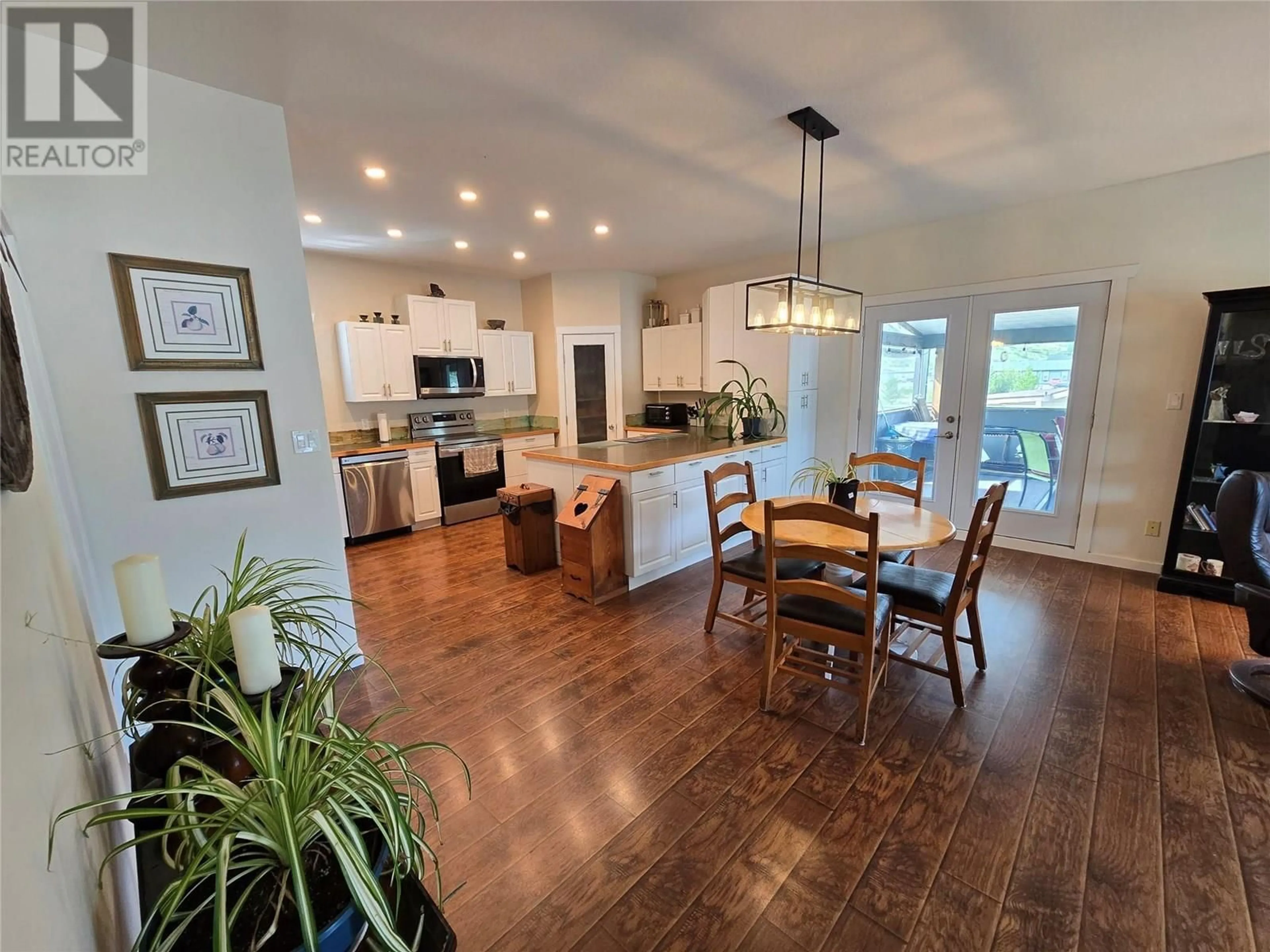 Open concept kitchen, wood/laminate floor for 401 MCLEAN ROAD, Barriere British Columbia V0E1E0