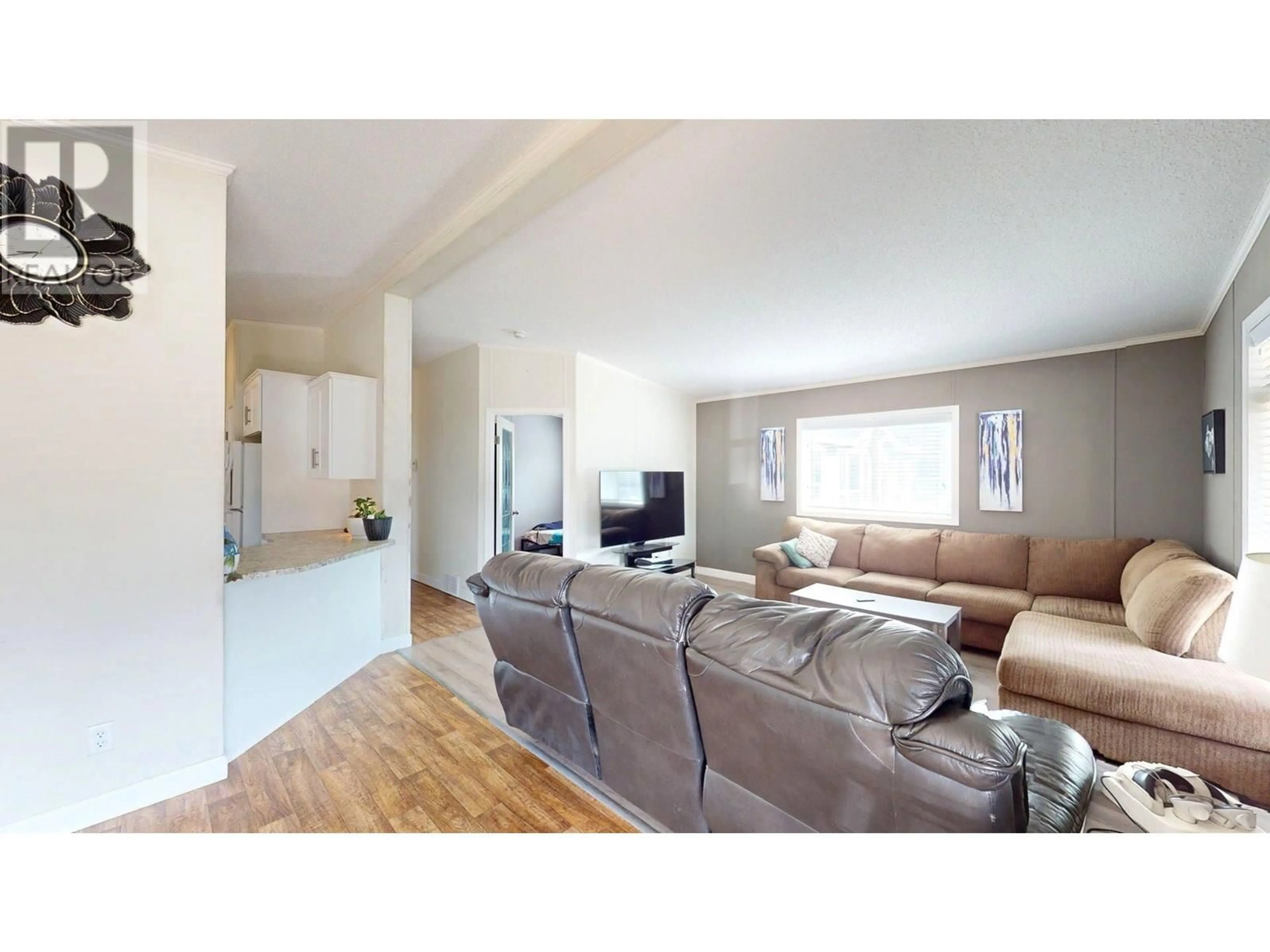 Living room with furniture, wood/laminate floor for 11 WILDERNESS HEIGHTS DRIVE, Elkford British Columbia V0B1H0
