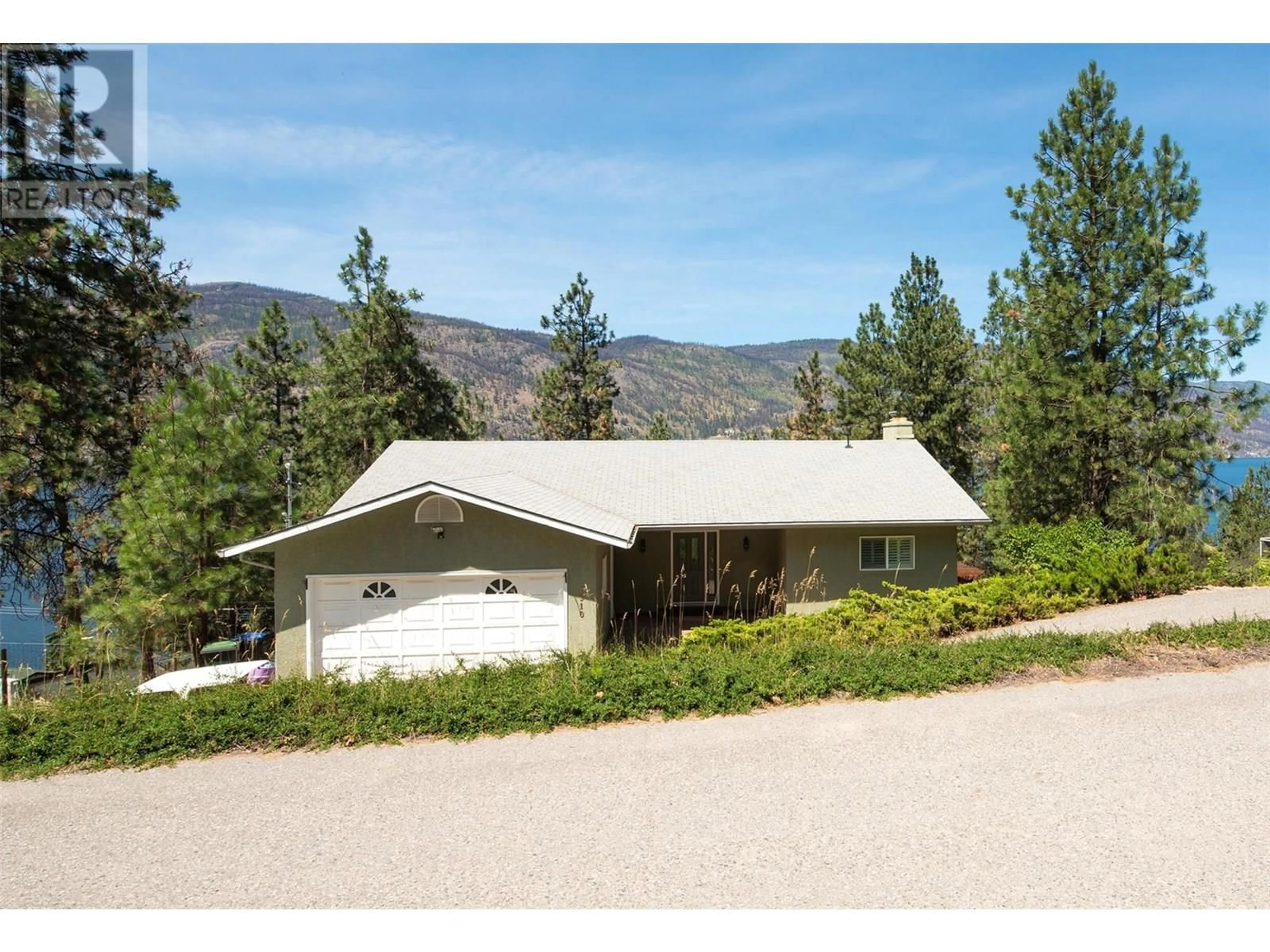 A pic from outside/outdoor area/front of a property/back of a property/a pic from drone, mountain view for 1310 MCKINLEY ROAD, Kelowna British Columbia V1V2B7