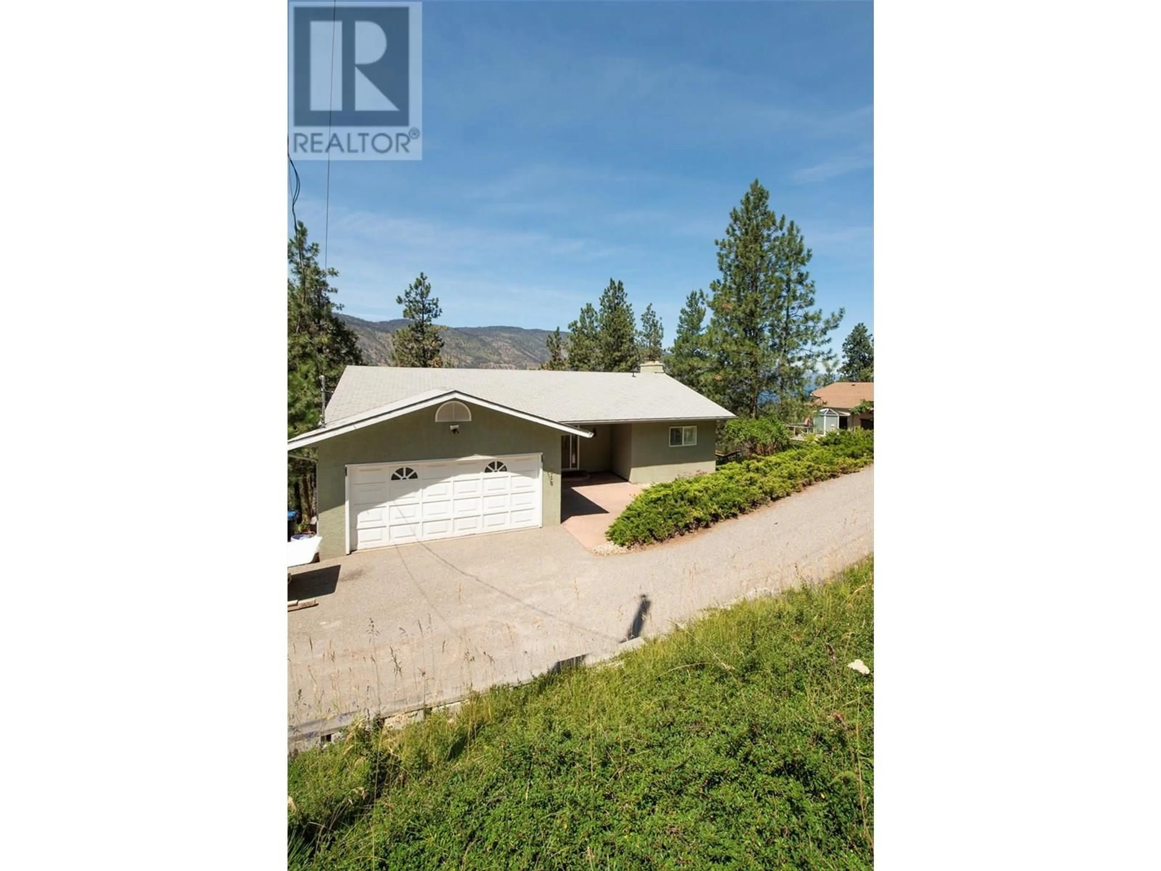 A pic from outside/outdoor area/front of a property/back of a property/a pic from drone, street for 1310 MCKINLEY ROAD, Kelowna British Columbia V1V2B7