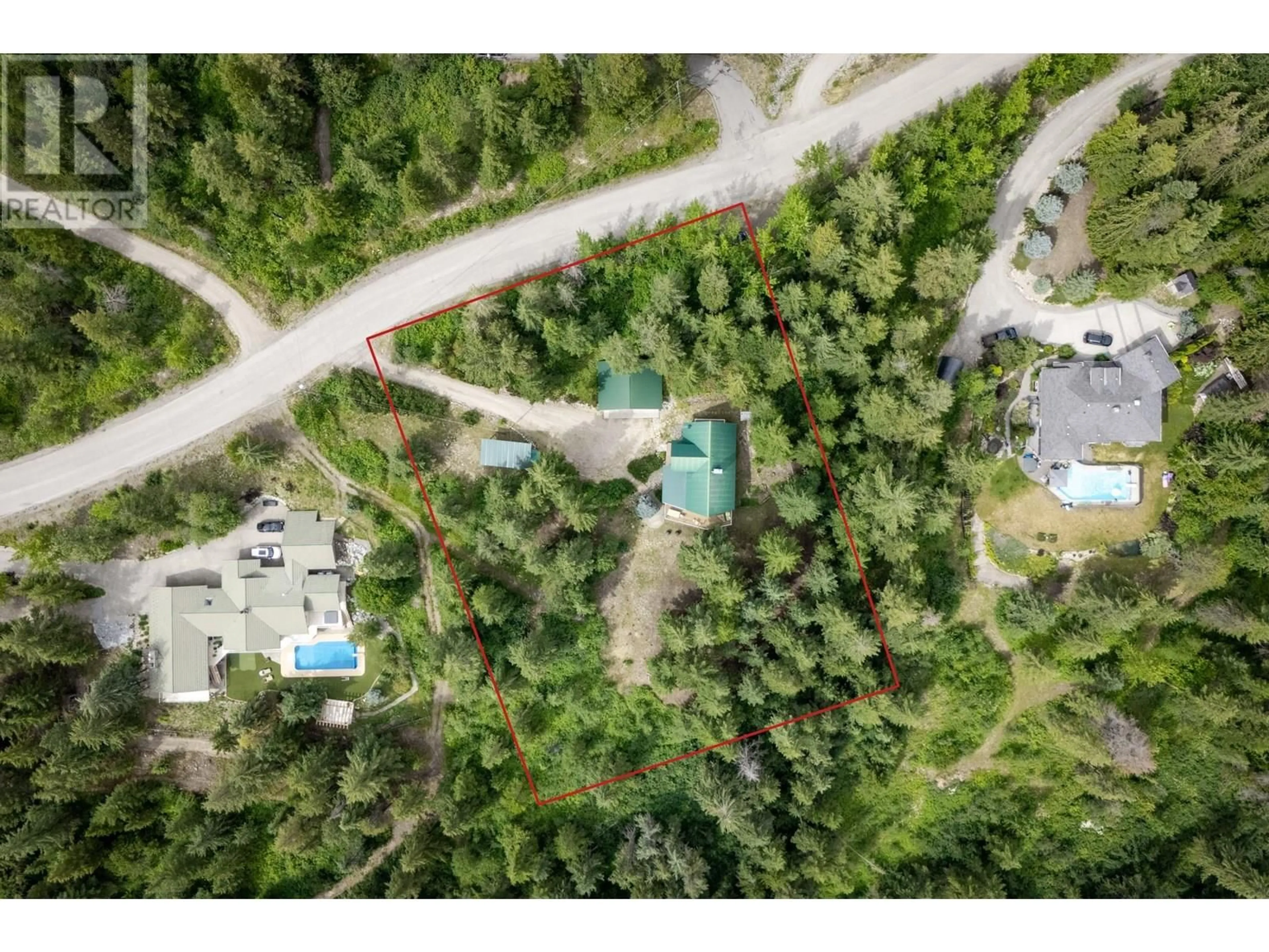 A pic from outside/outdoor area/front of a property/back of a property/a pic from drone, forest/trees view for 8080 JACKPINE ROAD, Vernon British Columbia V1T6L6